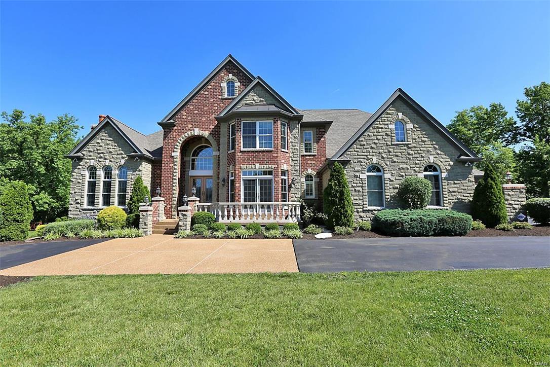 Classic 1.5 story on 1.34 acre lot in Chapel Hill; Stately elevation w/custom finishes; Brick & stone; 4 car o/s garag; 5 bdr, 5 full ba + 2 half ba; Approx. 7,000 sq. ft. ML & UL + 3,000 sq. ft. LL; 4 bay wndows; 4 frpls; Dramatic marble 2 sty foyer leads to formal DR rm w/private balcony; Library w/double french drs built-in bookcases & frpl; 2 sty great rm boasts flr to ceiling atrium windows, frpl & book cases; Gourmet kitchen w/custom cabnets, center island, butler pantry, SS appliances, gas cook top, granite counters, brkfst bar & walk-in pantry; Main flr luxury master suite w/coffered ceiling, sitting rm w/frpl & his/hers walk-in closets; Luxury master ba w/his/hers vanities, o/s shower w/steam, Jet tub; UL 4 large bdrs w/walk-in closets, 3 ba, spacious bonus rm/loft & 2nd staircase; 9' and 11' ceiling ML; 10’ LL; 8' drs; Transom & Palladian windows; w/o LL offers rec rm, multi-purpose rm, game rm, home theater, full kit, full bath.