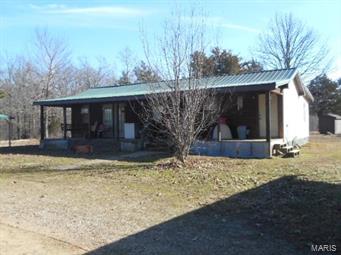 Very private and quiet 13 acres with a 2 bedroom home is ready for your horses or other livestock.  10 acres is pasture with a pond, fenced and has been surveyed. 24x32 barn that was once used for stables is also included.  The barn has a concrete floor in the middle, and a tack room.
