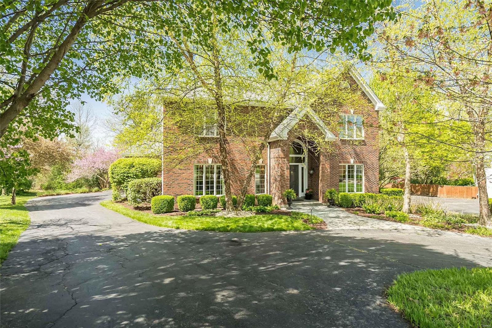 LADUE SCHOOLS and this  EXQUISITE TWO STORY, 4B/6BA ON A QUIET, FRIENDLY CUL-DE-SAC!  Enjoy the bounty of this seller's great taste in decor:  Abundant crown molding, detailed lighting, lush flooring and custom remodels.  Be WOW'ed from the front door and throughout w/ this 27-year-young updated home.  Hardwood floors + tall windows abound on the ML w/ 9' ceilings, custom built-ins, 2 half baths, ML laundry, DR, Liv Rm, Great Rm w/ blt-ins, fantastic wet bar & gas FP; plus there's room for your biggest table in the oversized kitchen & seating area. UL has (2019) REMODELED OWNER'S SUITE w/ HUGE w/in closet, and gorgeous bathroom for 2. Plush carpet carries you to 3 OTHER UL BEDROOMS: Two w/ blt-in desks; 1 w/ en suite bath;  2 share J&J bathroom.
FIN LL hosts LARGE PRIVATE OFFICE, LIVING AREA, BAR, WORK OUT AREA, SAUNA and WALK-OUT.  PARK-LIKE, PRIVATE YARD and OVERSIZED 3 CAR GAR complete this incredible LUXURY HOME convenient to excellent schools and highways.