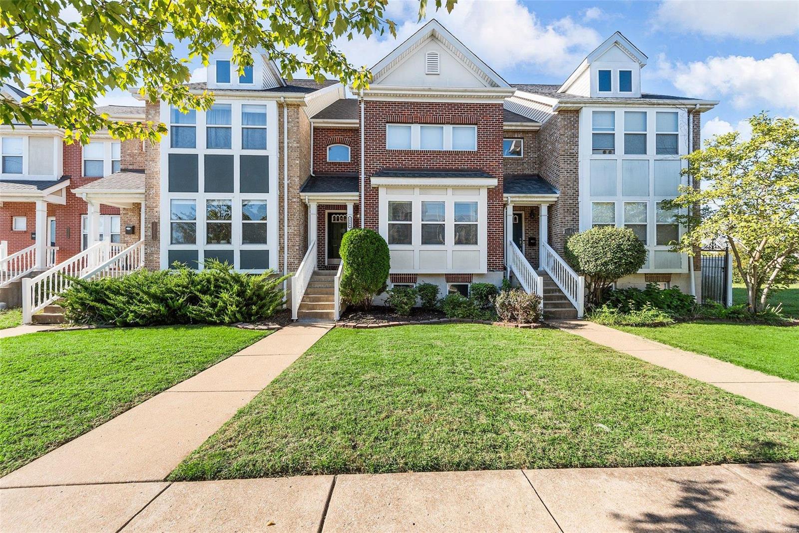 Welcome to this spectacular 2 story townhouse located in the CWE. As you step inside you'll feel the spaciousness of the 2 sty living room with hardwood floors and filled with natural light. The adjoining dining room creates an ideal area for entertaining. The kitchen boasts granite countertops, breakfast bar, SS appliances and pantry. Main floor laundry is conveniently located off the kitchen, along with a half bath. A spacious bedroom with a private bath completes the main level. At the end of the day escape to the expansive upper level loft and primary suite complete with WIC, a large soaker tub, separate shower and double vanities. The lower level features a walk-in cedar closet, bonus room and another full bath. Enjoy the privacy of your fenced in backyard with enough room for your fur babies to run. A sidewalk leads to the 2 car garage. Great location in the CWE with restaurants, retail and close proximity to Forest Park, City Foundry and other STL favorites!