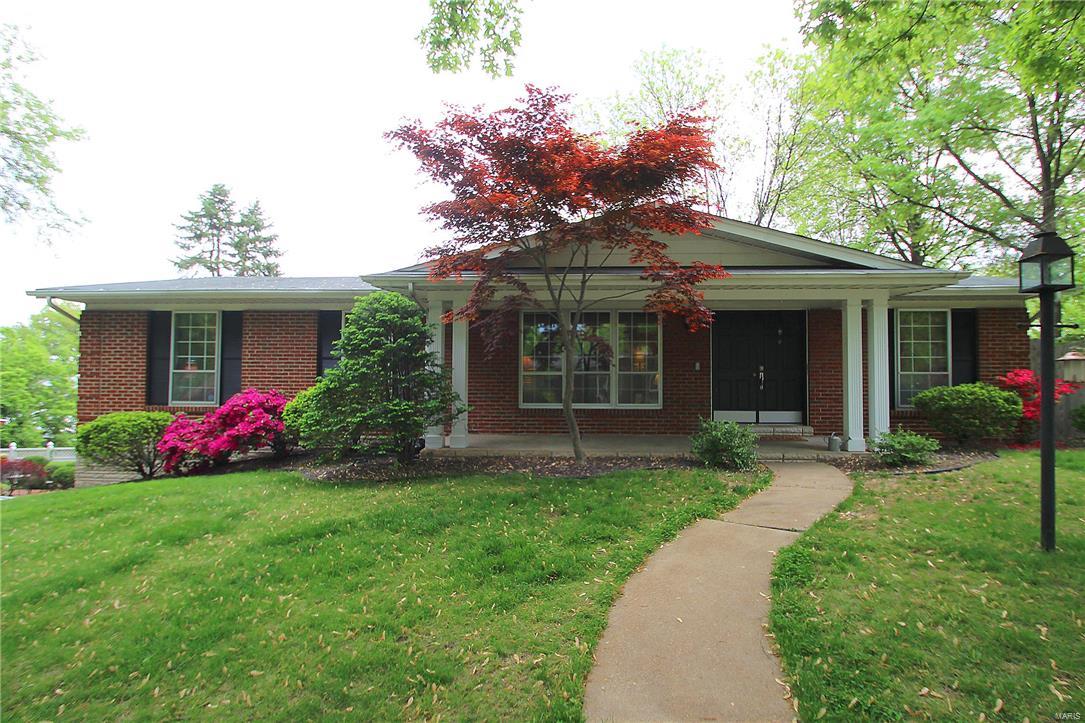 Updated 3 bdrm 2.5 bath brick ranch with finished walk out lower level and 2 car side entry garage on a fenced corner lot in Bridlewood Estates across from Grant's Farm in Lindbergh School District.  Home features hardwood floors thru out, an updated gourmet kitchen with granite counters, white wood cabinets, refrigerator and gas range included.  Hardwood entry foyer separates spacious living room and separate dining room.  The family room has ventless gas fireplace and open stairwell leading to the finished lower level.  Updated master and hall baths.  Walk out lower level w/ newer carpet and tile floors, a 12 ft long bar for entertaining, and a large finished storage room and laundry room.  All appliances stay including washer and dryer.  Newer roof and updated electric panel.  Garage has 2 newer doors with separate openers.  Garage turnaround has basketball goal and is perfect for a court.  Walking distance to Grant's farm and the walking trail.  Seller offering 1 year HMS warranty.