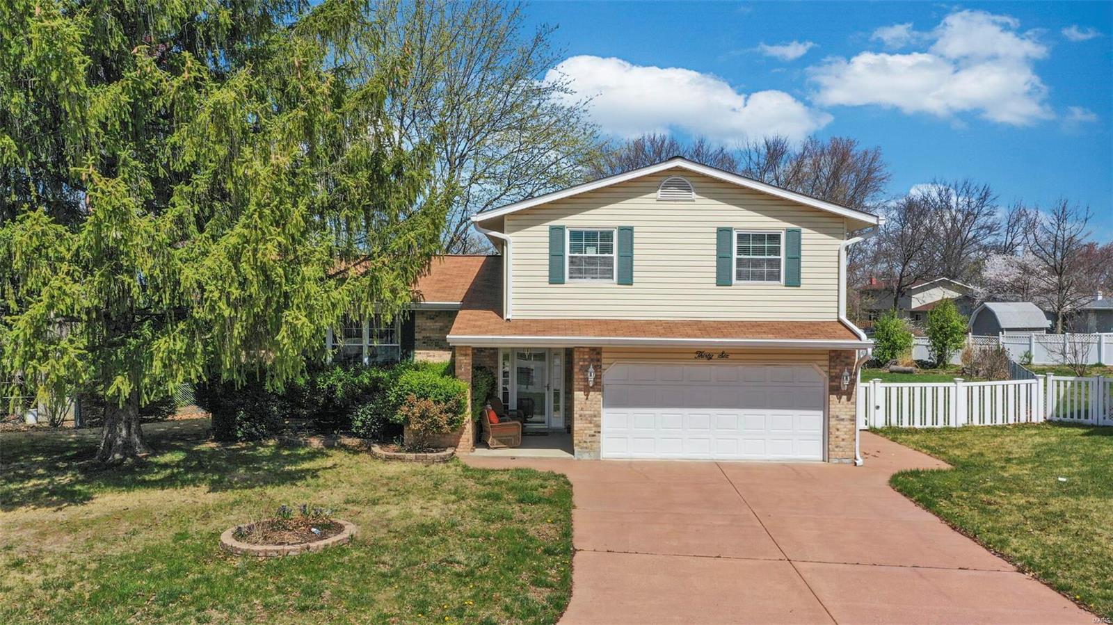Beautiful home sits on large .39 acre lot with fencing and lots of mature trees for privacy. Vaulted living room. Large dining rm w/wood floor. Huge updated kitchen w/wood floor & 42" maple cabinets, granite countertops, brkfst bar, wine bar & bay window w/seat. Large family rm w/wood floor, brick fireplace and 4 window french doors lead to mazing backyard with brick patio, above ground pool w/deck, storage shed & tons of space. MFL & 1/2 bath on main. Up you find a very large master bed w/sitting area, walk in closet & full bath. 2 other great sized bedrms and large hall bath. Down you find a drywalled room that could easily be done into a game rm & rough in for bath. Big covered front porch, about 1/2 brick front & vinyl siding.
