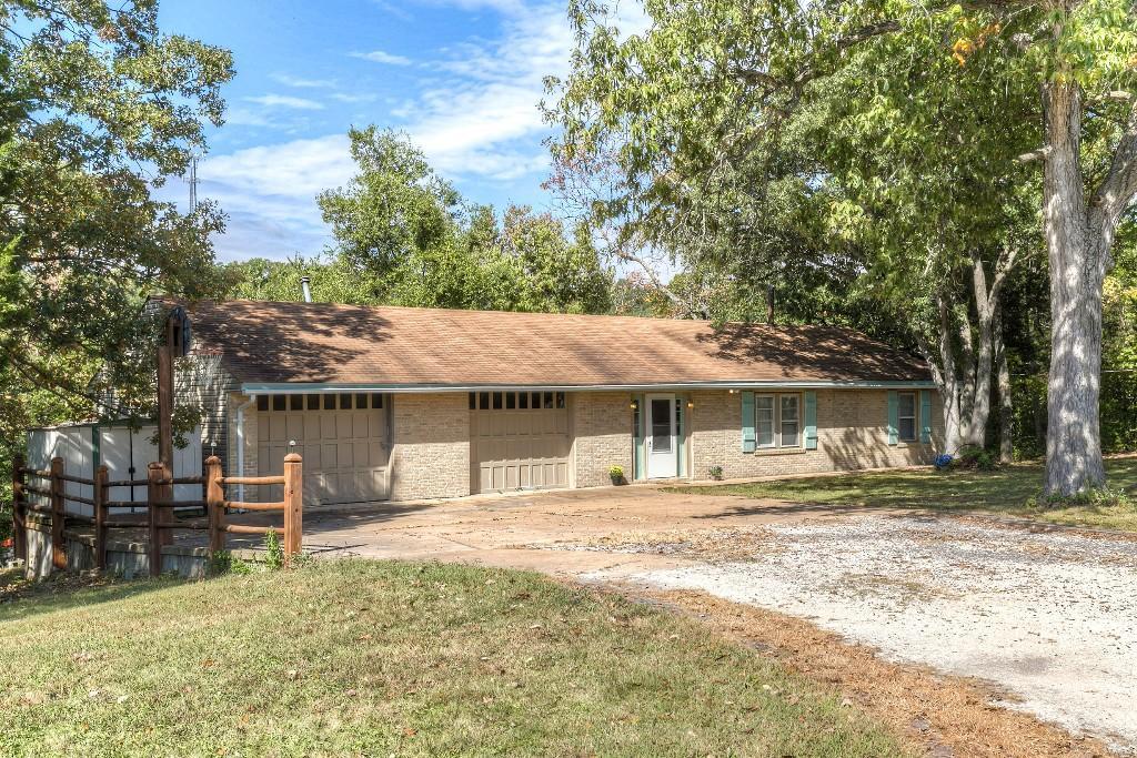 The best of both worlds here...enjoy the peace and tranquility of the country, but the conveniences of the city.  This home sits on 3+ acres and comes with an amazing panoramic view of the countryside.  This ranch has an open floor plan with a light and airy feel and a 2 car garage to boot!