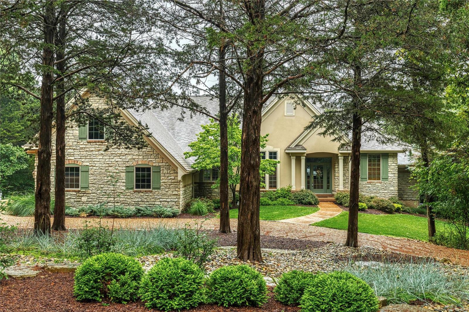 This lake home is a favorite of many at Innsbrook! Now, this custom-built Homer Award lakefront beauty can be yours.You'll fall in love with this home just steps from Lake Charrette, whether enjoying the close water view from the wall of windows, grilling on the maintenance-free deck or enjoying the grassy yard with the lake for a playground. 2 levels of gorgeous finished living space, the first floor features an open floor plan with sunroom, hearth room & gas fireplace + office that could easily be converted to a bedroom if needed. The main level owner's suite overlooks the water with an expansive his/her bath & an oversized closet. Lower level features a walk-out rec room complete w/pool table and wet bar & 2 additional bedrooms, exercise room, full bath & plenty of storage. 3 car garage. No detail has been missed. Just minutes from the Main Gate, hurry  to see this beautiful lake home.This home can be enjoyed full-time or as vacation home. Additional Rooms: Mud Room, Sun Room