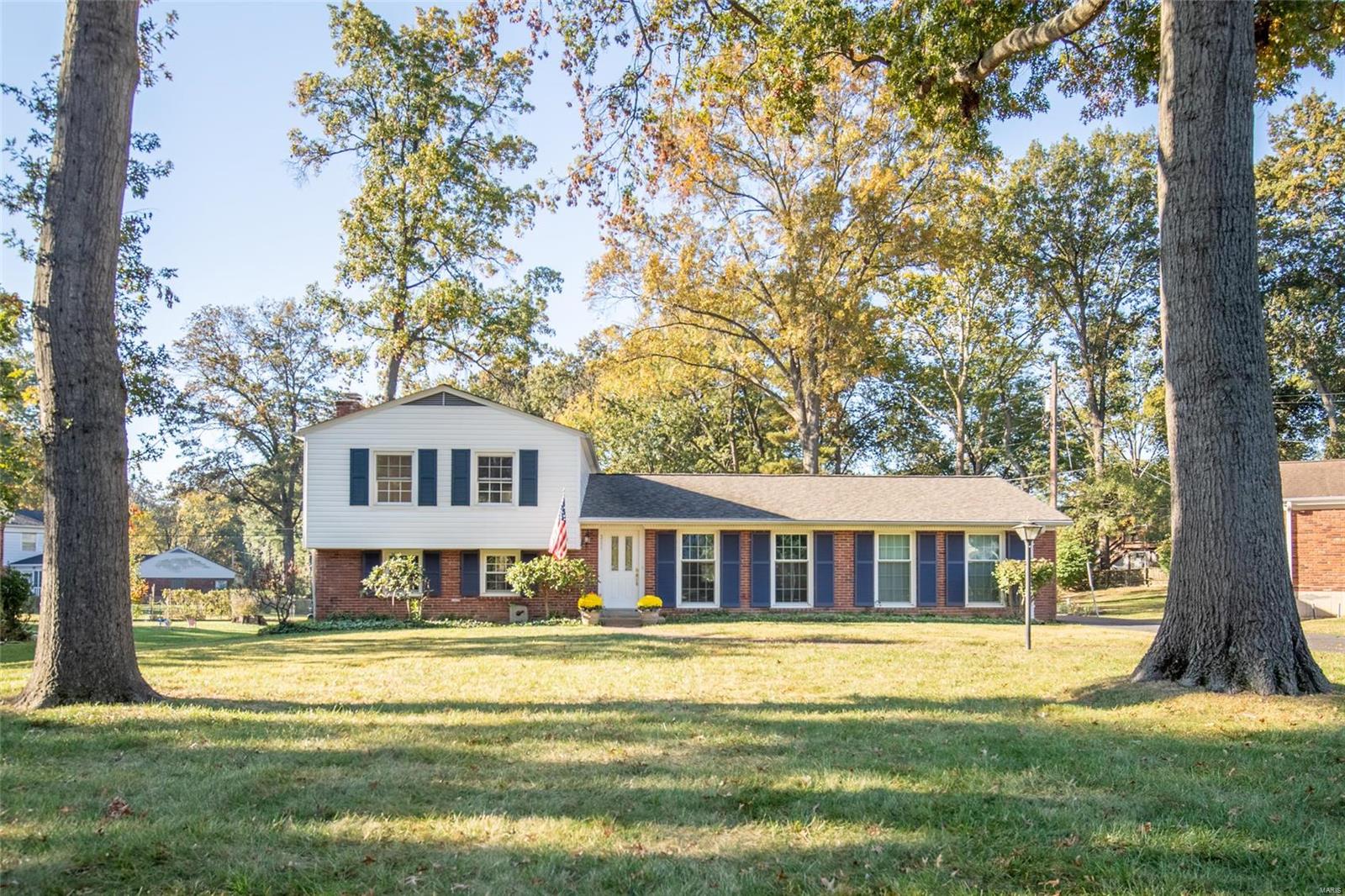 Nestled in the Cherry Hill Estates subdivision, you'll find this beautiful home sporting recent updates to the exterior including the roof, siding, and shutters. As you step inside, you'll be welcomed by a spacious living/dining room combo with large windows that provide plenty of natural light. Attached you'll find a charming kitchen, this recently painted room has ample cabinet space with lighting below and counterspace to match. As you step down from the kitchen you'll see the large carpeted family room with a cozy fireplace, perfect for those chilly St. Louis nights. This lower floor also includes a laundry room with a washer/dryer, as well as a half bath. Upstairs you'll find the three bedrooms, each one boasting beautiful wood floors and closets. The primary bedroom contains a newly remodeled full bathroom completed just this year. Conveniently, you'll find a second full bathroom upstairs that is just steps away from the two guestrooms. This home is beautiful both inside and out.