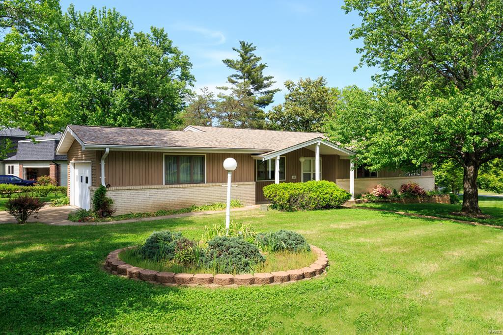 Desirable 4 bedroom, 2 bath Ranch many updates. From the moment you enter you will be impressed.  Gleaming hardwood fls throughout the main level. Newer kitchen with granite counters & updated white appl. Built in breakfast bar overlooks large Fam room which as w/b fireplace, peg & Plank wood flooring and door to patio. Separate formal living room with built in shelving and dining room large enough for those big parties!  Master bedroom suite with extensively upgraded full master bath. 3 additional large beds all have wood floors and hall bath is updated as well. Newer Anderson windows in most rooms, vinyl siding, encl soffit, fascia & gutters all replaced in 2006. Concrete oversized patio and driveway were completed 05/06. Roof is approx 10 yrs old.  Lower level is older finish but plenty of room for an incredible family area if you desire.  Office/den also in lower level for privacy. Plenty of storage.  Level corner lot and side entry 2 car oversized garage complete the package.