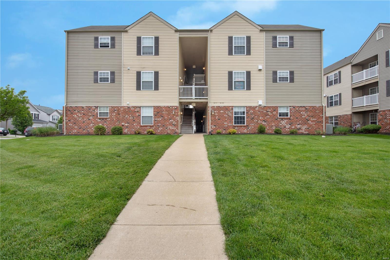 GREAT LOCATION! EASY ACCESS TO 40/364, Near Restaurants, shops, playground, lake, and walking path.  This beautiful 2 bedroom, 2nd floor unit is light and bright with lots of sunshine.  Spacious eat in kitchen boasts maple cabinets, newer matching appliances and large pantry.  Enjoy your private balcony with storage closet.  Foyer leads to open floor plan perfect for entertaining.  Unit comes with its own private laundry for ease of daily living and a bonus inside storage room!  Enjoy maintenance free living.  A MUST SEE! Location: Interior Unit