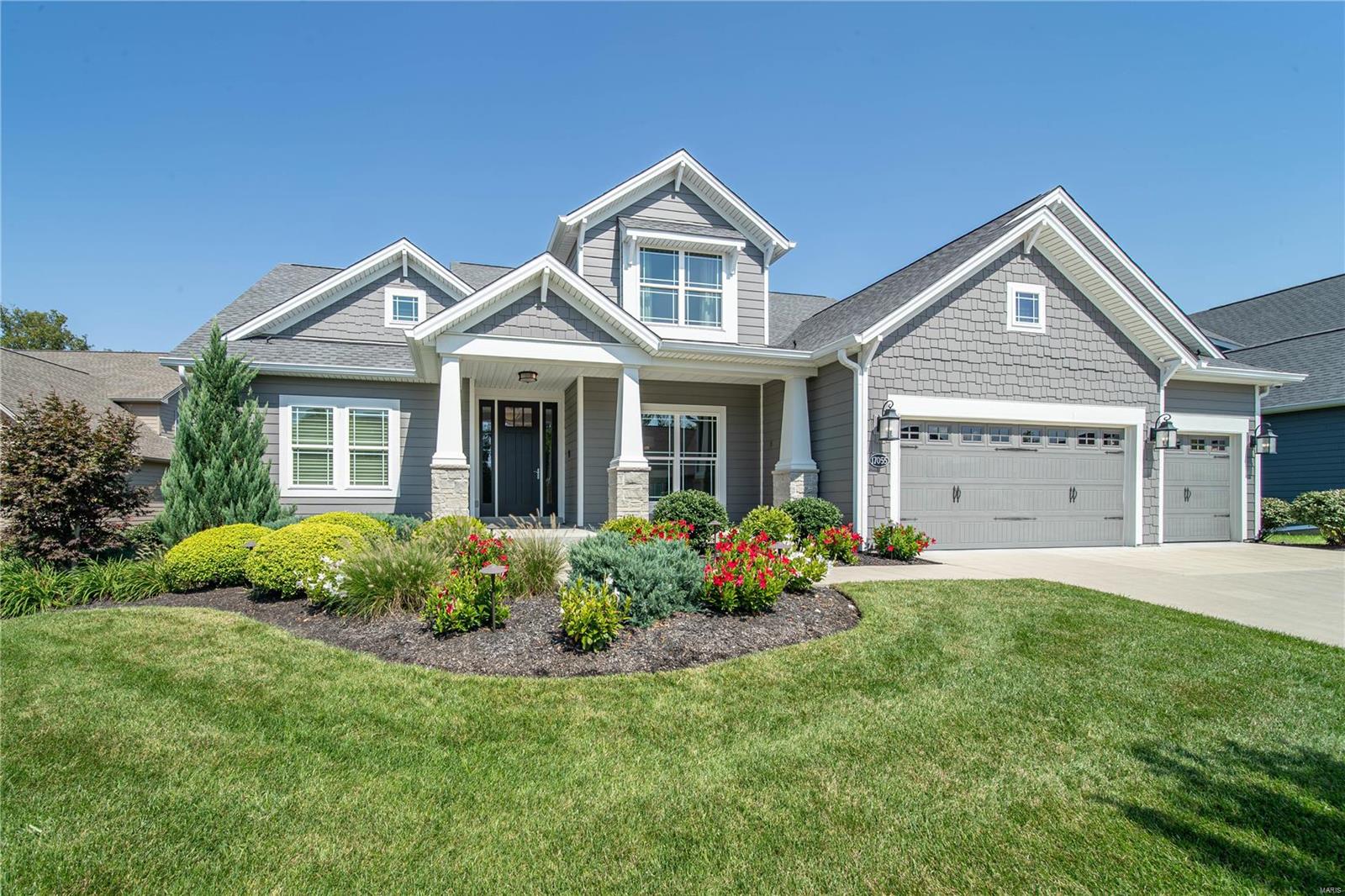 This stunning home will be love at first sight! The great room features big, bright windows & a stone fireplace. The spacious kitchen has a large center island, stainless appliances, double ovens, pantry, & breakfast room. The separate dining room offers more space for formal meals. The elegant sunroom leads to the patio tucked into a private & lushly landscaped nook of the backyard, the perfect place to enjoy your morning coffee. The main floor primary bedroom suite is an oasis to retire to at the end of the day with a coffered ceiling, full bath with a separate soaking tub, two vanities, & plenty of closet space. Upstairs you’ll find a versatile loft area, three additional bedrooms & two full baths. The lower level is ready to finish to your taste—an egress window & rough-in give you a head start. A full-house water purification system, built-in sound system, & finished 3-car garage add extra touches of luxury. Fridge, washer & dryer stay with the home for your convenience.