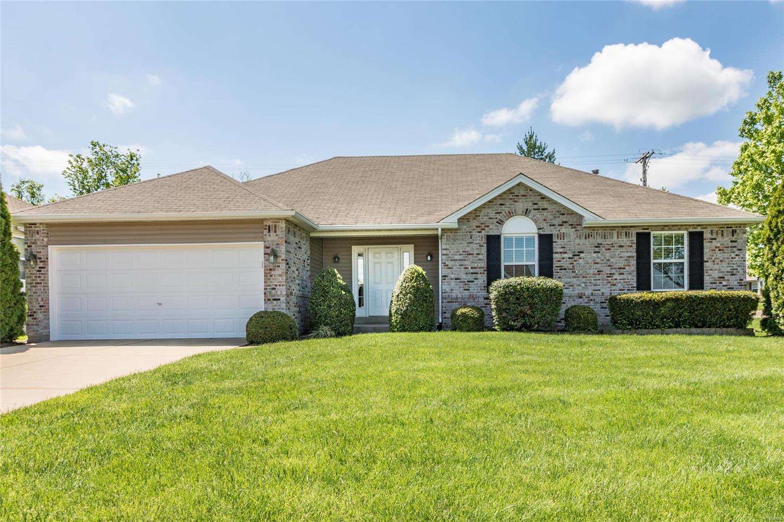 Welcome to this newer ranch (16 yrs. old) on a spacious corner lot. Beautiful brick front elevation and hip roof is just the beginning. Enter into large hardwood floor foyer leading to a large vaulted great room with a contemporary gas fire place. Freshly painted walls and ceilings and new carpet (4/2021) and flooring has just be installed. Open spacious kitchen and breakfast area with open spindled rail and steps leading to the basement. Plenty of room and large closet in the main floor laundry leading to the to the garage with off set extra storage/work area. Bay area in breakfast room with door leading out to a low maintenance composite surface deck. Awesome owners suite with double entrance doors and great bath with double sinks, jet tub, separate shower and huge walk in closet. Spacious 2nd and 3rd bedrooms with overhead lighting. Wide open unfinished basement with full bath rough in for the future finish. Very solid home in great condition. Please come tour.