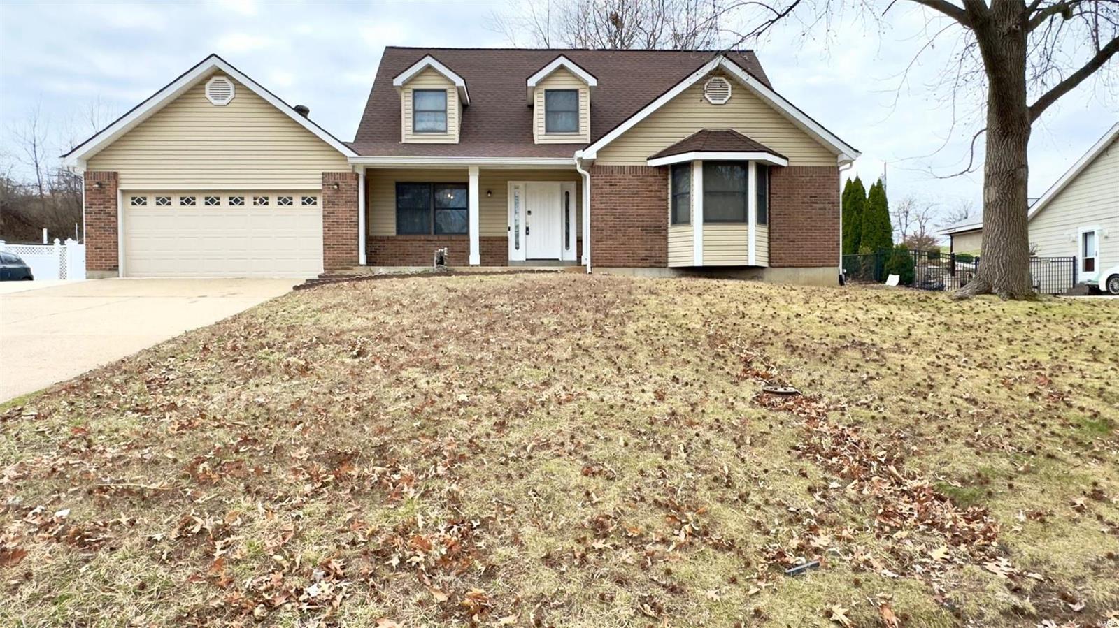 This is not a house, this is a home and you will feel the love as you step into this stunning 3 bed, 2.5 bath 1.5 story home nestled in the Pattonville School District. With a divided bedroom floor plan, enjoy vaulted ceilings, walk-in closets, and gorgeous wood flooring throughout the main level. The living room dazzles with a beautiful brick fireplace and abundant natural light, while the kitchen offers ample cabinet space, a breakfast room, pantry, and a large center island. Revel in the spacious rooms, main floor master, dining/bonus room, main floor laundry, loft that could be made into a 4th bedroom, finished basement including a media room and wet bar, and an attached oversized 2-car garage with attic storage area. Play basketball on the additional 2-car driveway. Then fire up the BBQ and Relax on the covered patio overlooking the large, fenced backyard in this serene sidewalk lined neighborhood. Welcome home!