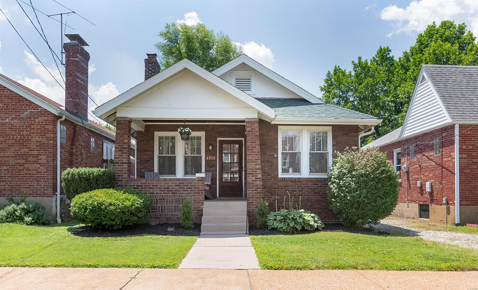 Ready to meet your new bestie on Scanlan? The sweetest home on the block just got a makeover! IF we can get you off the BEST front porch & into the house..you will see what all the chit-chat is about.Open floor plan flows from living room to formal dining. Stunning hardwood floors & fresh paint thru out. Recently renovated bathroom will make you feel like you are being featured in St.Louis Magazine. Great sized bedrms & plenty of closet space. Our favorite room of the house? The dreamy new kitchen! Granite countertops, SS appliances, white cabinetry, tile flooring, & subway tile backsplash! Adorable four seasons room off kitchen adds to your living space year round :) Backyard is ready for a south city bash- HUGE patio, 2 CAR GARAGE opens up to the back yard & a hammock you can spend day dreaming about living at Scanlan. Newer roof, windows, fresh & clean basement. Location you just can't beat- get your walking shoes on, your going to Biggies-Tilles Park or El Pasano to start. Cheers!