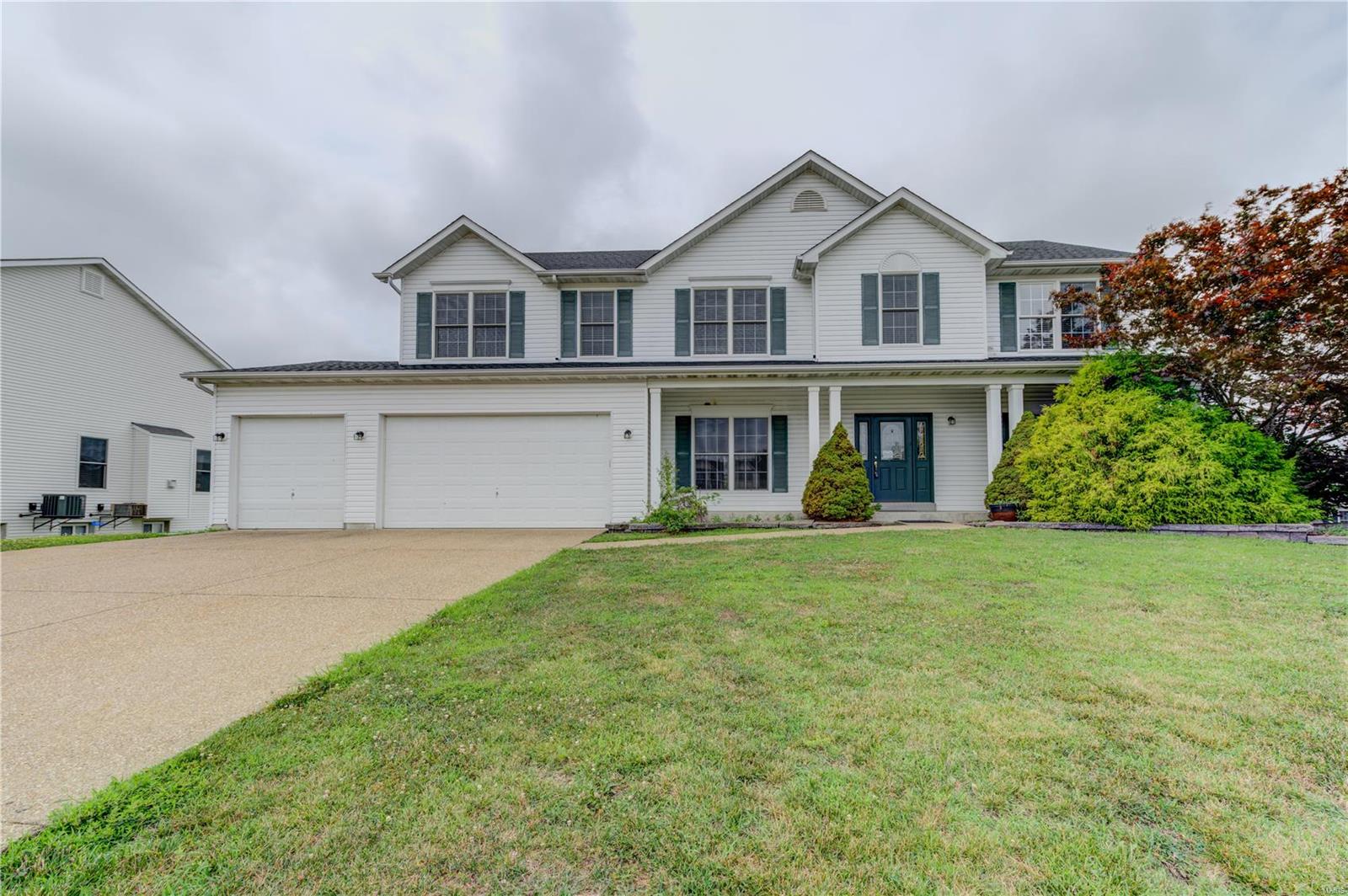 Bookended by two cul-de-sacs, this 2 sty, 4 bed, 2.5 bath home sits on a .45 ac lot within Villages of Dardenne McCluer. Over 3,000 sq ft, the main level has 9’ ceilings, LR, DR, FR with gas fireplace, enlarged kitchen with 42” cherry cabinets, breakfast bar and center island, bay window with door to deck, and convenient MFL. The upper level boasts master suite with adjoining luxury bath and 2 walk-in closets, with 3 addl bedrooms and loft area. The unfinished, 9’ pour, walk-out LL offers a variety of possibilities for more living space, with rough-in bath and door to huge, level backyard with vinyl fencing and lawn irrigation system. White 6-panel doors, fresh, neutral paint, newer carpeting, and roof (June 2022), dual HVAC systems, 3-car garage has oversized 8’ garage doors. Subdivision amenities include pools, clubhouse, walking trails, ponds, and more. Quick access to highways, Ft Zumwalt schools, with shopping and restaurants nearby. “As-is” sale, seller to make no repair
