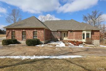 Quality abounds in this custom W/O ranch on 1.23 AC, backing to woods in desirable Fiddlestix Subd. Much curb appeal w/stone stamped driveway & mature trees. Finished oversized 3-car w/8’ carriage doors & cent vac. Wood entry opens to vaulted Great Rm & Formal Dining w/impressive wall of windows. Highlights include 10’ ceilings & 8’ doors on all levels, rounded corners, soaring vaults w/ample lighting. Kitchen boasts a pass-thru, ceramic tile, solid surface counter, 42” cabinetry, breakfast bar, planning desk & Breakfast Rm accessible to covered deck for ease in entertaining. MF Laundry w/half bath, wet sink & cabinetry. Master suite w/dbl bowl vanity & 7x4.5’ glass block walk-in shower. Walk-in closets in all Bedrms with BR 2 & 3 served by hall bath. Wrought iron staircase leads to 10’ Lower Level (1700 sq ft app) w/4th sleeping/office area, ceramic in Family & Rec Rm, wet bar & bath areas. Step out to stamped patio & enjoy privacy of wooded lot complete w/irrigation sys. Don’t miss!