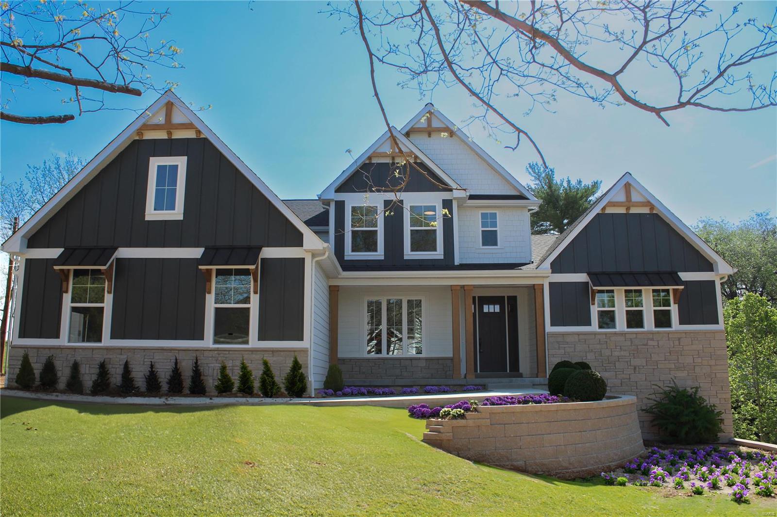 McKelvey’s Elegant Turnberry model available on .77 acre homesite in central location of Des Peres.  All the extras included in this 4148 sq ft 1.5 sty home, main floor owner’s suite. 16 X 14 Covered Patio, walk-out lower level & extensive landscaping. Features include Hardie Board siding, Optional Study with Double glass door, 8’ doors throughout the 1st floor, Oversized 3 car side entry garage. Expanded kitchen plan, Butler’s pantry, huge Walk-in pantry, Built-in appliances w/ Wood hood, 6 burner gas cooktop, double ovens w/ dutch doors, microwave drawer, and beverage fridge. Oversized laundry room w/ Built-in cubbies. 11’ high Great Room w/ transom windows that will make your jaw drop! Owner’s bedroom w/ tray ceiling and bath includes vaulted ceiling, free-standing bathtub, large walk-in closet. 2nd floor includes 3 large w/ large walk-in closets,  steps up to a Bonus Room with dry bar & beverage fridge for movie nights/slumber parties/game room or homework! End of April completion!
