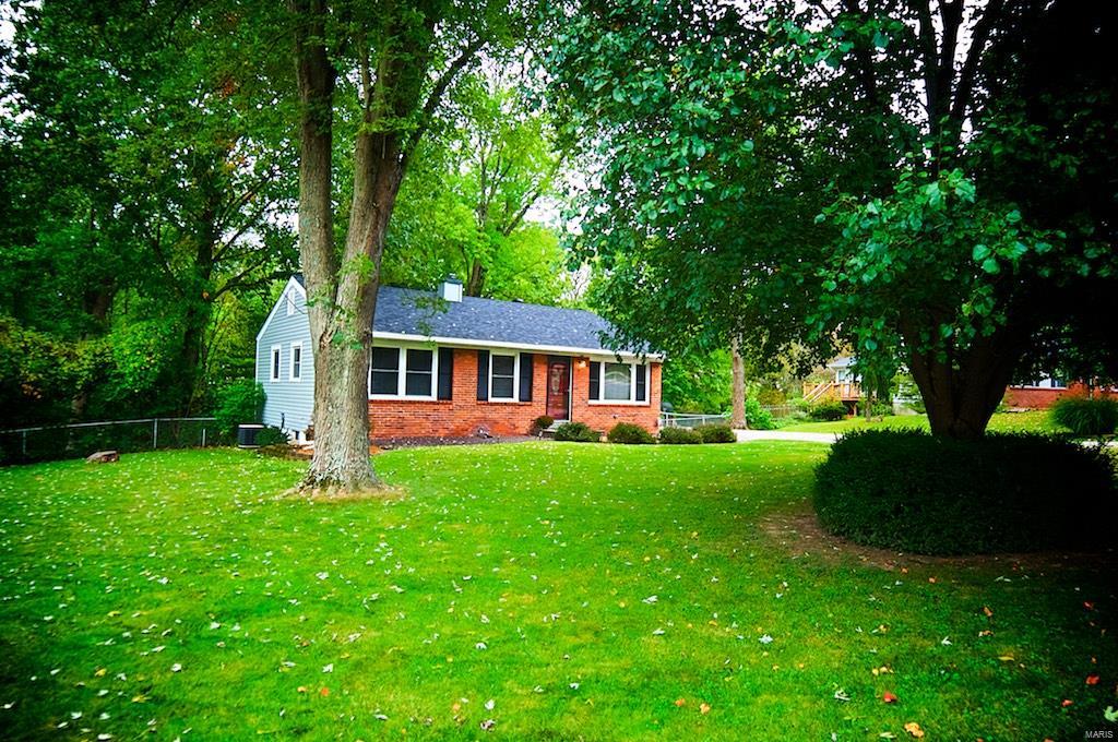 OPEN HOUSE CANCELLED! SOLD! Huge Level Fenced Yard! Just over Half an Acre! Backing to Trees, this is a Private Yard with loads of space. Wonderful outdoor area with large deck and fire pit area to enjoy those cool nights.  Pristine Wood floors grace the main floor featuring an open floor plan that is great for entertaining. Beautifully Updated Kitchen featuring wood cabinetry, stainless steel range, dishwasher, microwave and large double door Refrigerator stays! Seperate Dining Area and Three Bedrooms on the Main Level. Wonderfully remodeled bath in pottery barn style.  Newer Roof. Updated Windows. Full Lower Level is great for adding additional living space, great workout space and storage space! A1 rated Rockwood Schools! Convenient to Everything! Great First Time Home buyer loans available! Call and See Today!