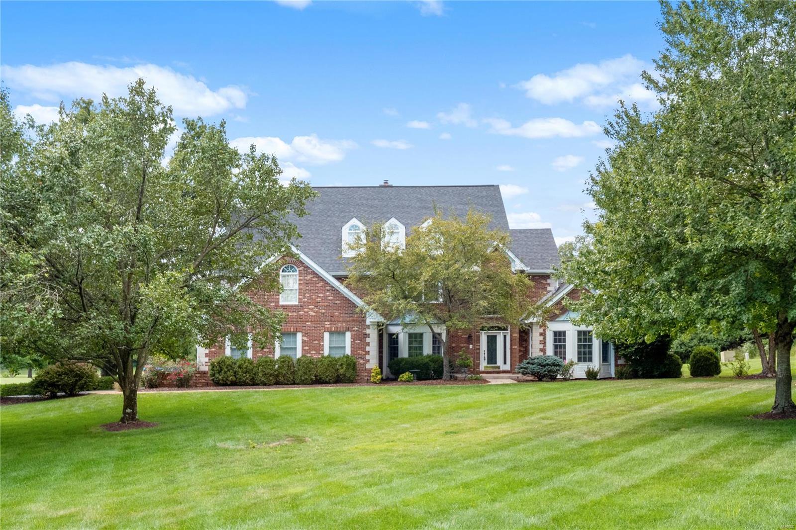 This beautiful 1.5 story is tucked away on 2+ acres on a private drive, overlooking the 7th fairway of the Forest Hills Golf Course! Enter to find the dining rm & a vaulted study w/ French doors. The 2 story beamed great rm offers a fireplace, walk-up wet bar & French doors to the deck where you can relax & enjoy the beautiful views. The gourmet kitchen boasts a center island w/ a breakfast bar, granite, double ovens & adjoining breakfast rm w/ a fireplace & opens to the sunrm. Retreat to the vaulted master suite w/ his & her walk-ins & lux bath w/ double vanities, jacuzzi tub & walk-in shower. 3 ensuite bedrms on the UL all w/ a private full bath & large closet space. The walk-out LL is ready for your finishing touches! Addtl features include ML laundry rm w/ half bath, sprinkler system, zoned HVAC, 3 car garage & so much more. This one-of-a-kind home offers an abundance of privacy & spectacular views while still being conveniently located within the heart of Chesterfield! Additional Rooms: Sun Room
