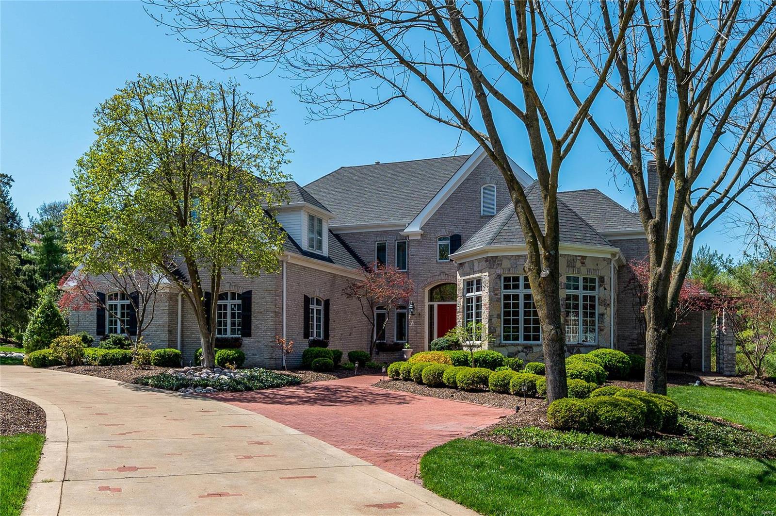 Custom masterpiece on one acre cul-de-sac lot in one of Frontenac’s most prestigious neighborhoods. Home offers a footprint of 8000+ sq. ft. The 2 story foyer, great room & dining room create a dynamic first impression. Well designed open floor plan w/ defined living space creates the perfect flow for those who love to entertain inside & out. While touring, notice the dramatic ceilings, double french doors that lead out to patio, picture framed molding, crown molding & abundance of natural light. Office/library, front & back stairs, large kitchen w/ breakfast rm, hearth rm & access to your own private oasis. Main floor owners suite w/ large walk in closet & luxurious spa like bath. Upper level includes 3 bd rms (all en suite). Finished LL: Living rm. bar, media rm, gym, full bath w/ steamer, wine cellar & tasting room. Resort-like exterior w/ gorgeous pool and wading pool, waterfall, Built-in grill, pool House w/ Pagoda & bath. 4 Zone HVAC, 4-Car Garage, & Whole House Backup Generator. Additional Rooms: Wine Cellar