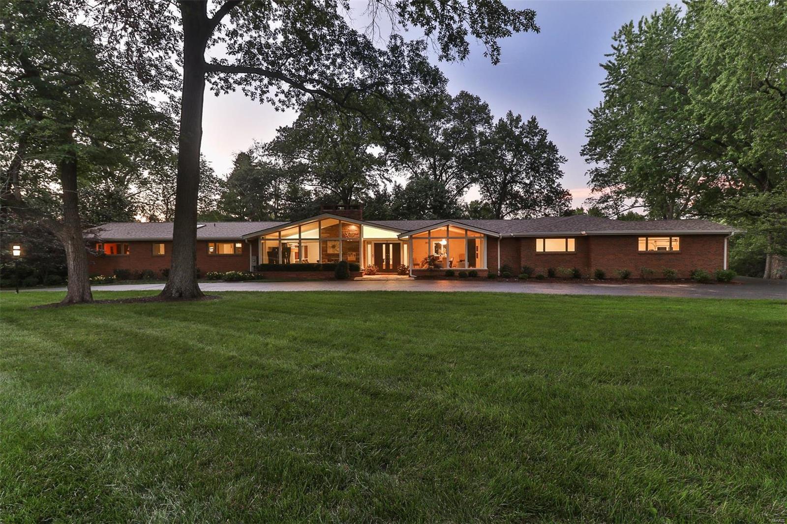 A mid-century ranch beautifully transitioned into a stunning transitional/modern styled home w 1.5 acres on a private street w/in walking distance to Plaza Frontenac & Schneithorst Village. Brand new (Jan 2018) state of the art gourmet kitchen.  This home features an open floor plan w vaulted ceilings, terrazzo floors & has a total of 8 skylights, 4 fireplaces, wood floors, & a brand new large main floor addition completed in 2018.  The addition includes: vaulted master bedroom w marble fireplace, a custom his/hers walk-in closet, heated marble floors in a double vanity master bath w free standing tub & walk-in marble shower, guest half bath, office nook & large custom mudroom w a first floor laundry.  This home includes an additional 2200 sq ft of living space on the lower level to total over 6000 sq ft of living space in the home.  A walk out basement w full kitchen, bedroom, exercise room, bathroom & rec room walks out to a salt water pool, spa, fire pit & putting green. Additional Rooms: Mud Room