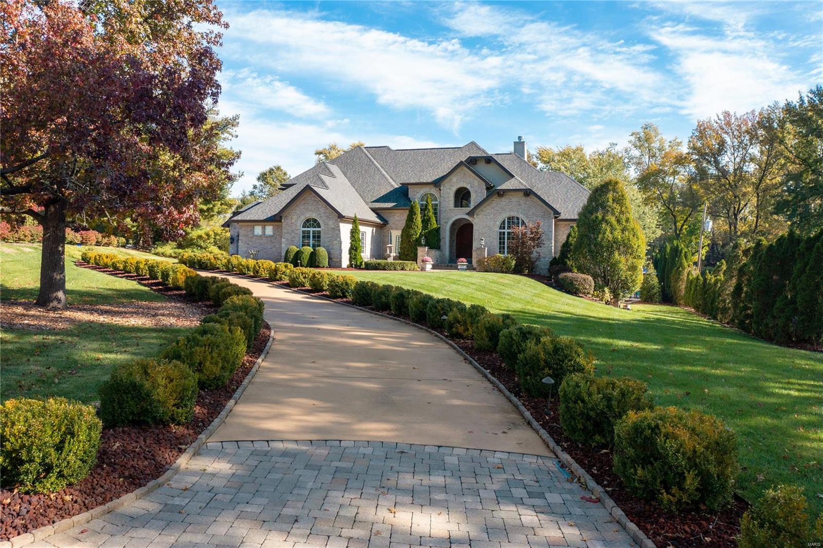 Showings begin at special open house Thursday 3/24 12-2p. Incredible custom built home situated on a 1.49 acre park-like yard. This special home has a great floor plan with a main floor primary suite complete with luxury bath and large walk-in closet as well as another generous main floor guest suite. The two story great room has 3 sets of French doors that lead to the covered patio and terrace. The cook's kitchen with high-end appliances, large center island, pantry and storage galore is open to the breakfast and hearth rooms. Upstairs you will find two bedroom suites, a loft with built in bookshelves and desk plus a 2nd floor laundry room. The walk-out lower level has a state of the art media room with tiered seating. In addition, a wine cellar, bar area, additional guest suite and family room currently used as an exercise room completes the lower level. Additional home features include: newer HVACs, newer roof, salt water pool & 3 car garage. Pictures do speak a thousand words Additional Rooms: Mud Room, Wine Cellar