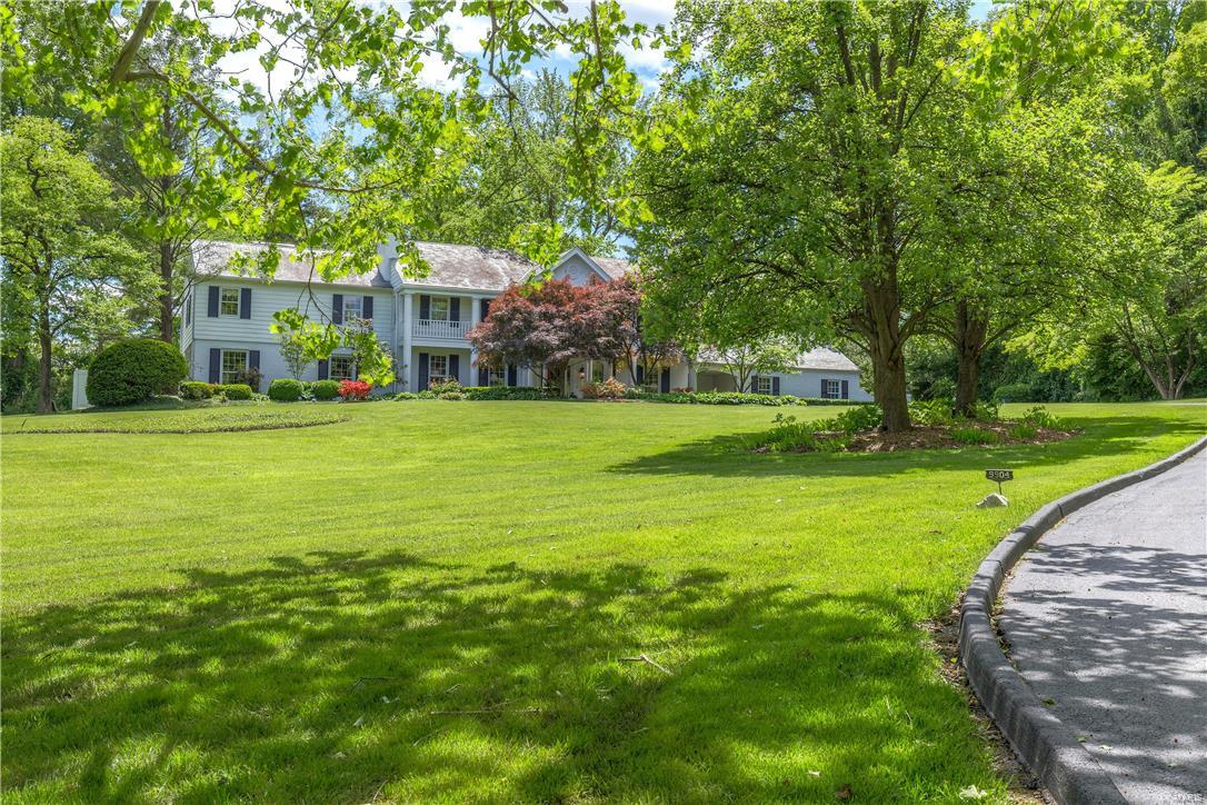 A private oasis on over 2.5 acres which is hidden from the street. Large kitchen/family/breakfast room with granite counter tops, a wall of windows overlooking a private patio, with mudroom/pantry entrance, and an attached butler's pantry with an additional dishwasher and sink making entertaining a dream. Another spacious family room overlooking the private side yard with access to the newer screen porch featuring gas fireplace and outdoor TV. In addition there is a guest suite with sitting room and private bath on the first floor and a good size home office with fireplace.  Large master bedroom suite includes a fireplace, a dressing room with multiple closets and a built in dressing table, large bath with double sinks, soaking tub, wonderful shower with body jets, and then there is a large room entering the master that has a closet and shares a bathroom...could be a sitting room, office or nursery.  4 other bedrooms and porch room on second floor. 3 car gar, 3+ carport spcs. Generator