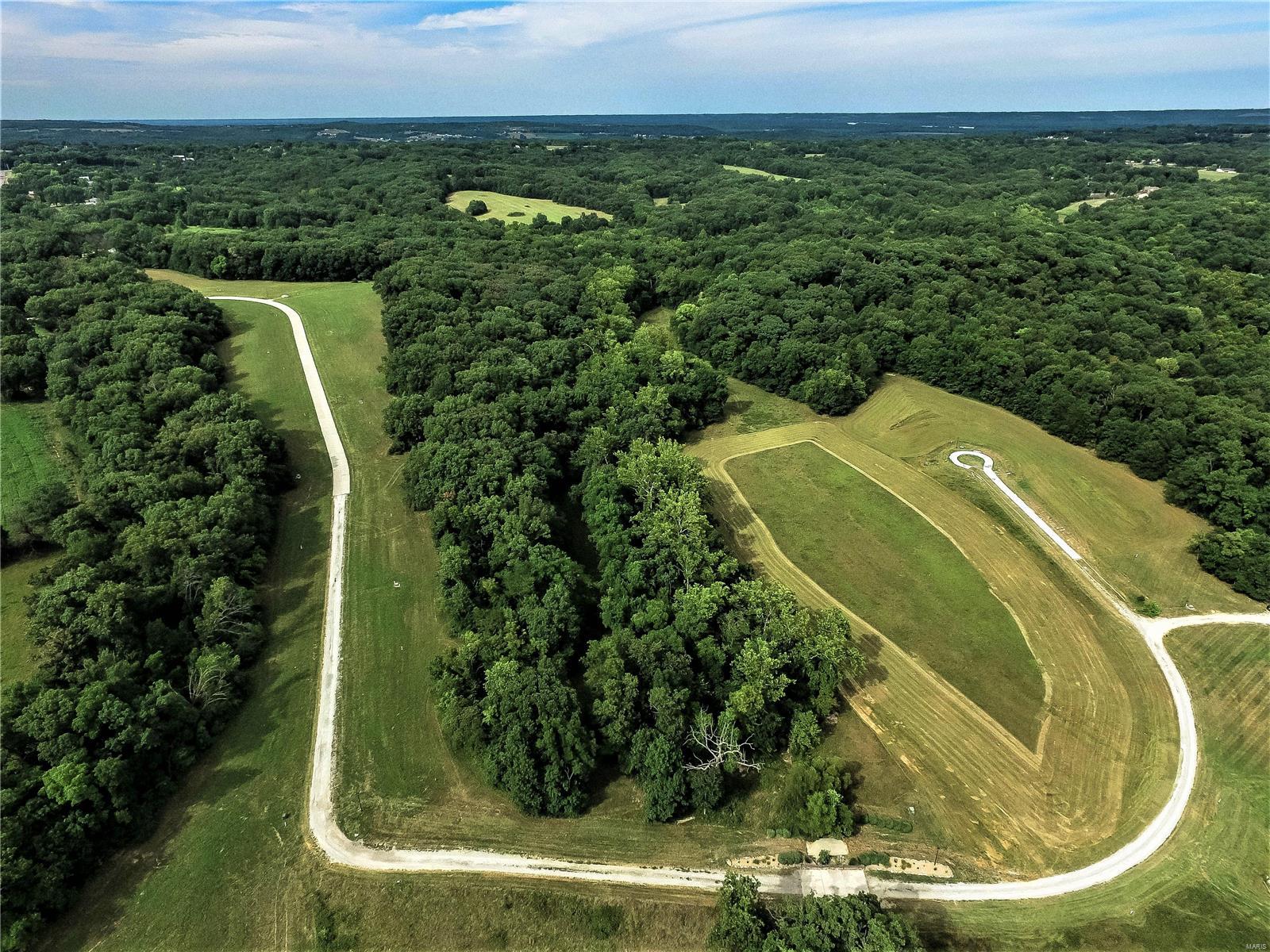 Welcome to this GORGEOUS New Construction Community! 3+ ACRE CUSTOM HOMESITES.  16 lots left to choose from in this PRIVATE 25 premium lot subdivision.  Bring your Builder and your plan! Indentures available for your review! Public water & electric  run to each lot for you already! Cable is available too!  Each lot is LEVEL and backs to trees! Up and coming Winfield is ideally located! Just a short distance to Troy via Hwy 47 or take Hwy 79 to O'Fallon/St. Peters! 

This is a BEAUTIFUL community and worth a stroll through!  Road is still being installed so thank you for your patience! Additional Rooms: In Platted Subdv.