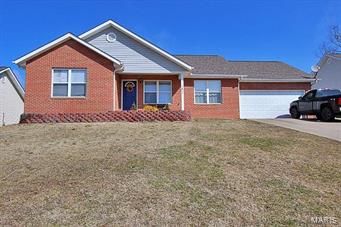 Brick and vinyl ranch has 3 bedrooms on the main level and a 4th bedroom in the mostly finished lower level.