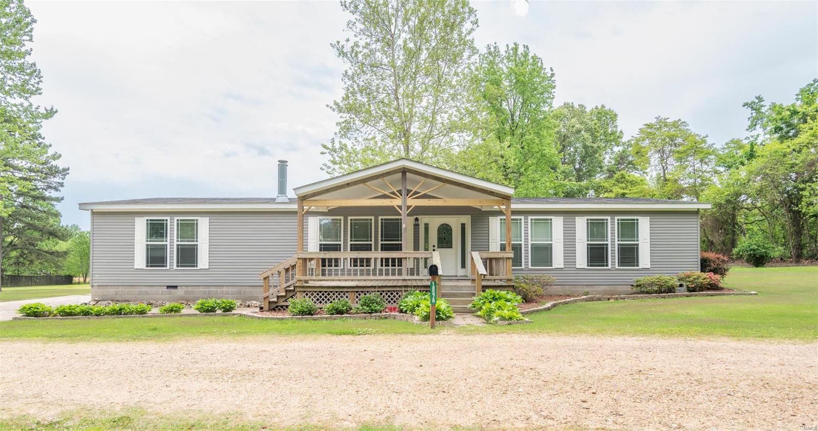 Welcome to your new oasis in Malden, MO! This stunning property features not one, but two spacious homes perfect for multi-family living or as a potential income property. The main home boasts a cozy fireplace, custom large kitchen with island, 4 large bedrooms and 2 baths, with the main bath having a jetted tub and separate shower.  The second home also boasts a fireplace, nice kitchen, new roof, and separate dining. Beautiful landscaping creates a park-like setting right in your own backyard, that you can easily enjoy from the nice front porches or back decks, the main home's back covered deck is huge. And can't forget the new roof! You'll also find a nice shop on the property, perfect for all of your DIY projects or hobbies. Whether you're looking for a peaceful, private, retreat or a place to entertain friends and family, this property has it all. You have to see it to appreciate it. Schedule your showing today!
