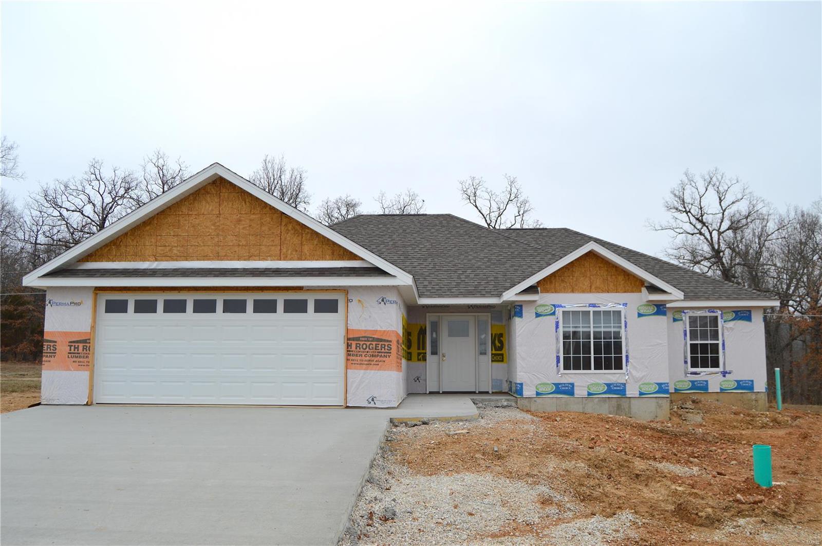 SOON TO BE COMPLETED-NEW CONSTRUCTION! Located in the highly sought after subdivision of Woodridge in the Waynesville School District, just minutes away from the main gate of Fort Leonard Wood. This property has all of the features you're looking for- Stainless steel appliances in the kitchen, stunning laminate flooring through out the kitchen, living room and hallways leading to the 4 carpeted bedrooms. Great level lot that backs to wooded area for added privacy! Home includes a 1 year Builders warranty. C&Rs are available and should be viewed prior to making an offer. All utilities are through the City of Saint Robert. Call your Agent today to find out how you can own your brand new home!