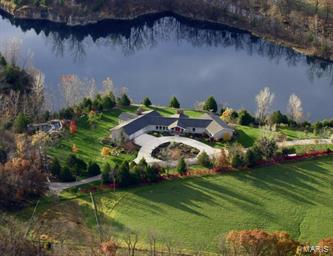 Located in Callaway County, MO a  225 ac Country Estate with Stately Home overlooking a Large Quarry Lake.  Bachelor Creek Valley runs through center of farm creating natural environment for wildlife.   Highlighting the property, a large, clear quarry lake with docks fully stocked.  Quality of material and craftsmanship in 8000 sq. ft. finished home.  The exquisite grand kitchen and hearth room/breakfast area combo w/ pine vaulted and exposed beam ceilings was designed for entertaining. 3 addtl wood burning fireplaces.  Each room on the South end of the home has a door that exits to the wraparound deck for outside views of  lake and waterfall.   Irrigation system on property maintains grounds and gardens.  Also, a two story guest home, vintage loft barn with coral, large machine shed, heated garage with workshop and outbuildings.   This Property is your Own Private Resort with Hunting, Rec, Horse Back Riding, Boating, Fishing, Swimming, and Diving all with Lavish Accommodations.