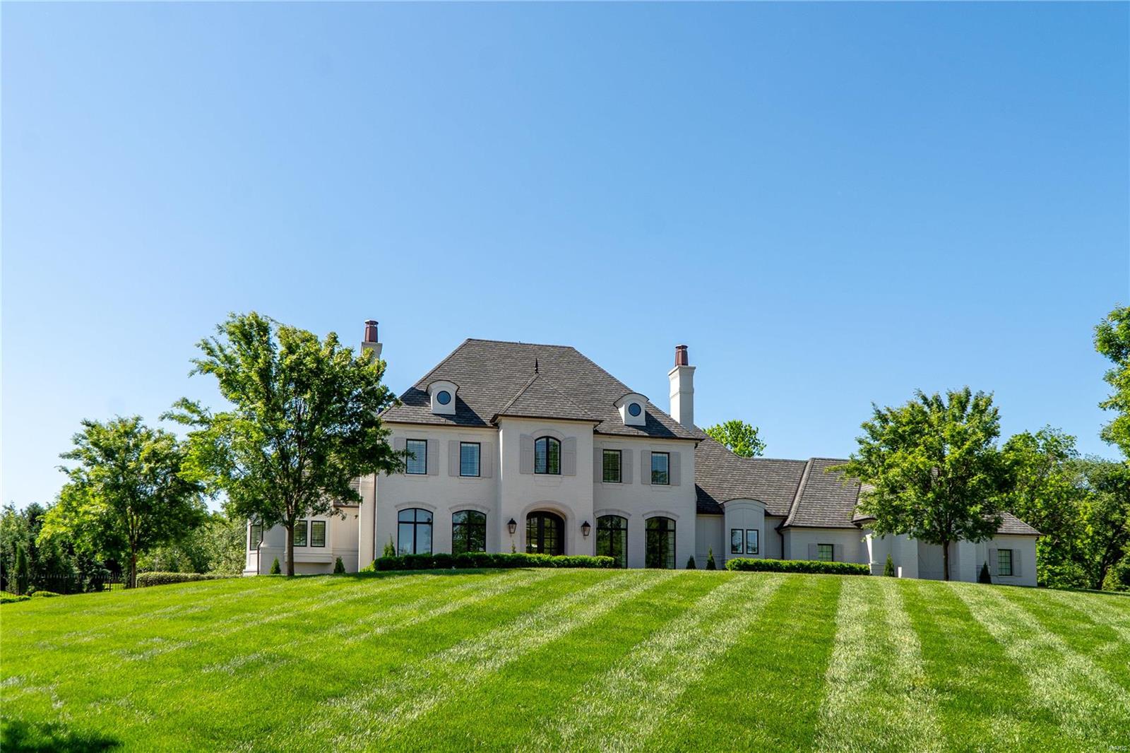 Welcome to your private oasis! Stunning Johnson-built home sits on 1.4 acres of lush landscape. Over 5000 square feet of living space, every detail exudes exquisite craftsmanship. Step into the grand foyer and be greeted by a captivating view through the LR offering a seamless transition to the outdoor pool & pool house. Main floor boasts a master suite featuring a gas fireplace, a spacious bathroom, & walk-in closet. There is a den,with built-in features,a separate large DR, a butler's pantry leads to a chef's kitchen, outfitted w/ top-of-the-line appliances and HR great for family gatherings. LL complete with custom bar, theater room,fitness room and much more. 2nd floor has 3 large suites with walk in closets.Discover a true haven of tranquility with meticulously landscaped gardens surrounding the pool. The pool house, equipped w/a kitchen and a rec room, offers the perfect retreat for relaxation or gatherings. An add't bedroom and full bath provide ultimate comfort and convenience. Additional Rooms: Mud Room
