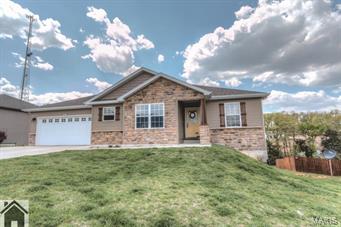Location, Location, Location! Only minutes from the main gates of FLW! Located in the Gospel Ridge Estates is this 4 bedroom 3 bathroom ranch-style home, on a full, partially finished walkout basement. The living room has access to the back deck, carpet and vaulted ceilings. The dining area and kitchen highlight 18” ceramic tile floors, tray ceilings, stainless steel appliances, solid-surface countertops, center island, pantry and custom, espresso cabinetry. Next, step into the attractive master suite with carpet, tray ceiling, specialty lighting and a walk-in closet, while the master bath features tile, two tall sinks and a two-door tile surrounded shower. Basement has a spacious family room with carpet, 4th bedroom, full bath, an unfinished John Deere room and a large storage area. Step out to the back deck where you have a wooded view. Seller will offer $2,000 of buyers closing costs and prepaids. Including a 13-month Home Warranty of America Platinum home warranty-amount of $500.