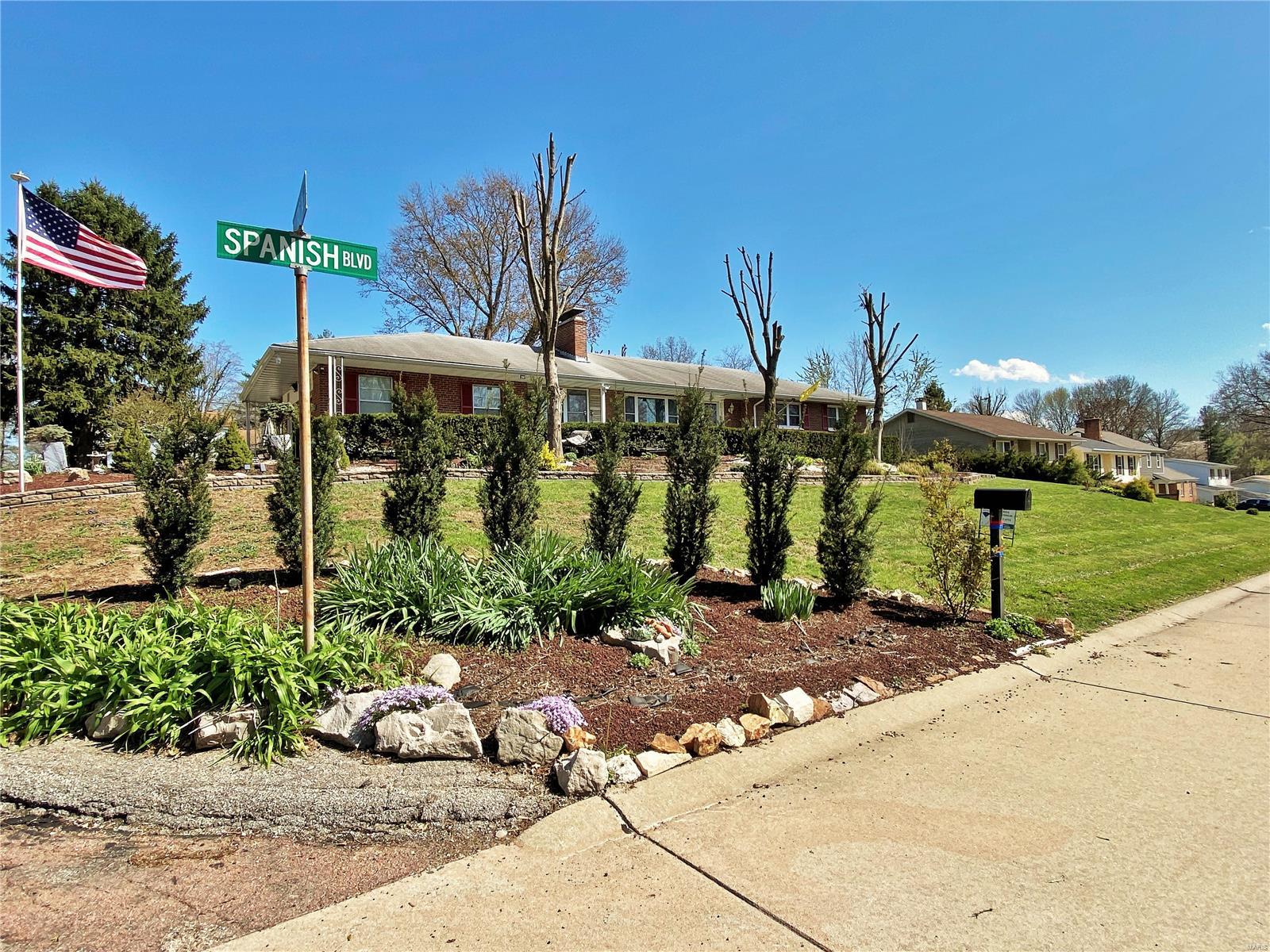 Exceptional, expansive 1 story Ranch, which in actuality offers 2300 sf of living space when taking the partially finished walk-out full basement into account.  Covered front porch; attached 2 car garage on left side with generous overhanging roof; small wood deck at back door.  Sports 3 bedrooms and a full bath on both the main and lower levels.  Sizeable great room extends out the back and provides both ceiling fans and fireplace for comfort.  Two additional wood burning fireplaces in the living room and partially finished lower level will surely add to this home's warmth.  Cooling is by central air.  This home sits smartly on a corner lot in a quiet neighborhood and its backyard is bounded by some fencing.  A long driveway provide ample off-street parking.  Working camera security system at this residence.  Appointments through MLS; Supra.