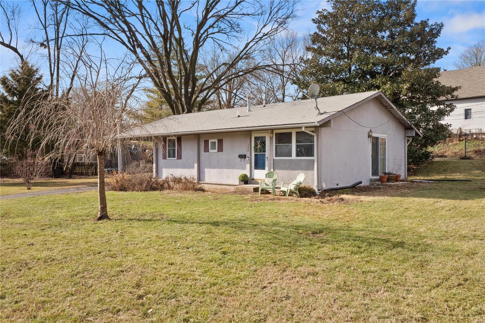 Welcome to 827 E Waymire, a fantastic value in Webster Groves! Classic hardwood floors throughout the home coupled with the open  dining, kitchen, and living room areas maximize the square footage in this adorable 3 bed/1 bath home! All three bedrooms offer great sleeping space, and the recently renovated bathroom is fresh and on-trend! The unfinished basement (HVAC replaced in '20) has tall ceilings and can easily be finished for additional living and/or bedroom space. An oversized carport provides covered off-street parking, and the large corner lot faces the lovely Deer Creek Greenway. The yard is full of native MO perennials which will bloom for years to come. Whether you plan to live in the home or add it to your real estate investment portfolio, this turn-key home is a perfect combination of function, location, and value! Please note: property is located in a flood zone but has a transferable flood insurance policy for $871/yr.