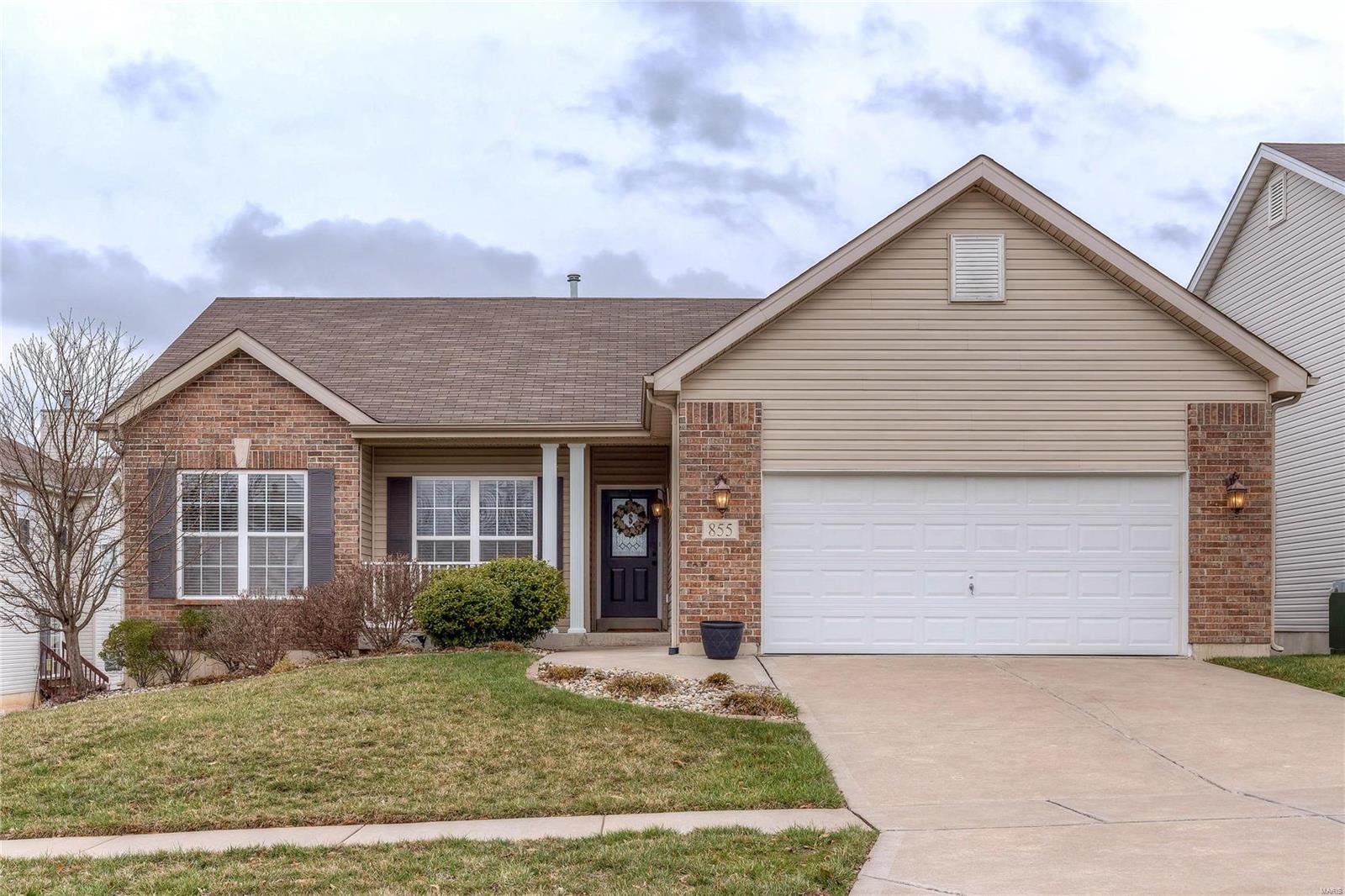 This well appointed & closely maintained home is sure to impress you from top to bottom! Main level includes some fresh paint, soaring ceiling vaults in great room coupled w/9 ft ceilings elsewhere, 6 panel doors, & sparkling hardwood floors! The great room features tons of natural light, cozy fireplace & flows seamlessly into the kitchen. There, you'll find upgraded 42” maple cabinets, large pantry, & spacious eating area. Main floor laundry just off the garage. Master suite has huge w/in closet, window bay, & full bath w/sep shower/tub & dbl vanity. The walkout LL will KNOCK YOUR SOCKS OFF. It boasts a HUGE TV/Rec area, game space, spacious half bath & FULL CUSTOM WETBAR. A completely ideal entertainment space! Storage room sets up well with a workshop/hobby space. Exterior impresses w/brick & vinyl elevation. You'll enjoy the deck/patio combo overlooking the level back yard with elevated plant/garden beds. HOME IS CLOSE TO EVERYTHING! Act fast! This home will be gone in a flash!