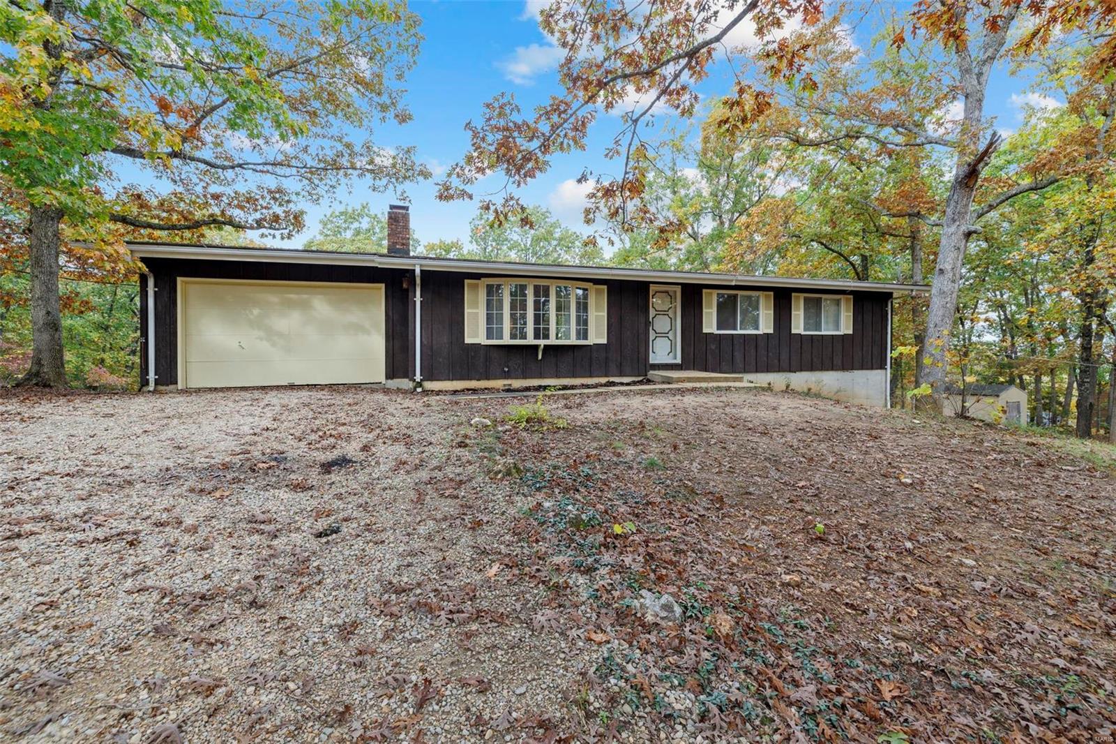 Make this your weekend getaway or your permanent home! This 3 bed 2 bath home has a full basement on 3.23 acres in the Terre du Lac community. Enjoy the wildlife this property has to offer. The wood burning fireplace is great in the cooler months and enjoy the new deck out back to grill in the warmer months! Lots of potential in this home. Woods basement has a transferrable lifetime warranty to give you added security!