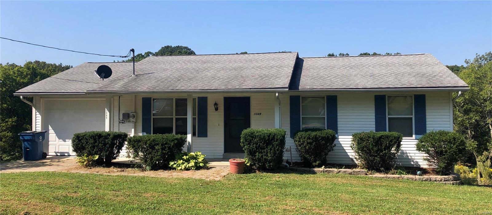 LOCATION IS THE KEY!  This 3 bedroom, 2 bath Ranch Style home is less than 5 minutes from HWY 55 and sits on .36+/- acres.  There are two driveways.  One goes to the oversized 1-car garage, the other to the lower level. Sit on the covered front porch or the new deck that walks down to a nice size patio.  Enter the front door and you be in the living room.  Next is the kitchen that features stainless steel appliances, a center island and sliding doors to the deck.  The master bedroom has its own bathroom.  There are two more bedrooms and a full bath on the main floor as well.  The lower level is an open slate for your imagination.  It includes a walk out, an egress window and a rough-in for a future bathroom.  No subdivision.  Crystal City School District.  The only thing missing is YOU!
