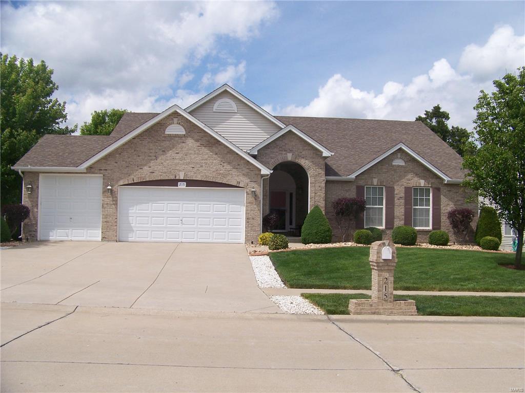 Stunning custom home welcomes you in. Travertine tile in foyer leads you into this open concept ranch where maple hardwood floors abound. The grt rm boasts a triple bay window as does the din rm, which also has a fireplace. The gourmet kitchen has 42" maple cabinets, quartz counter tops & backsplash, huge island w/quartz top. Breakfast rm has addtl sitting area. The spacious mstr bedrm suite is an oasis w/coffered ceiling, stunning 10x14 bath w/travertine tile, sep tub & shower, walkin closet. All bdrms had new carpet in 2012.  Office/bonus rm could easily be made into addtl bdrm. Enjoy evenings on the 14x20 maint free deck or grill on the side patio off kitchen. Walkout lower level has 2 lg windows, slider doors. Private & peaceful back yard backs to trees. Desirable lg corner lot &  excellent landscaping around entire home. Inground sprinklers, invisible pet fence, security system. 3 car garage - 3rd door is 8ft + tall. Pride of ownership really shows here. MOTIVATED SELLER !