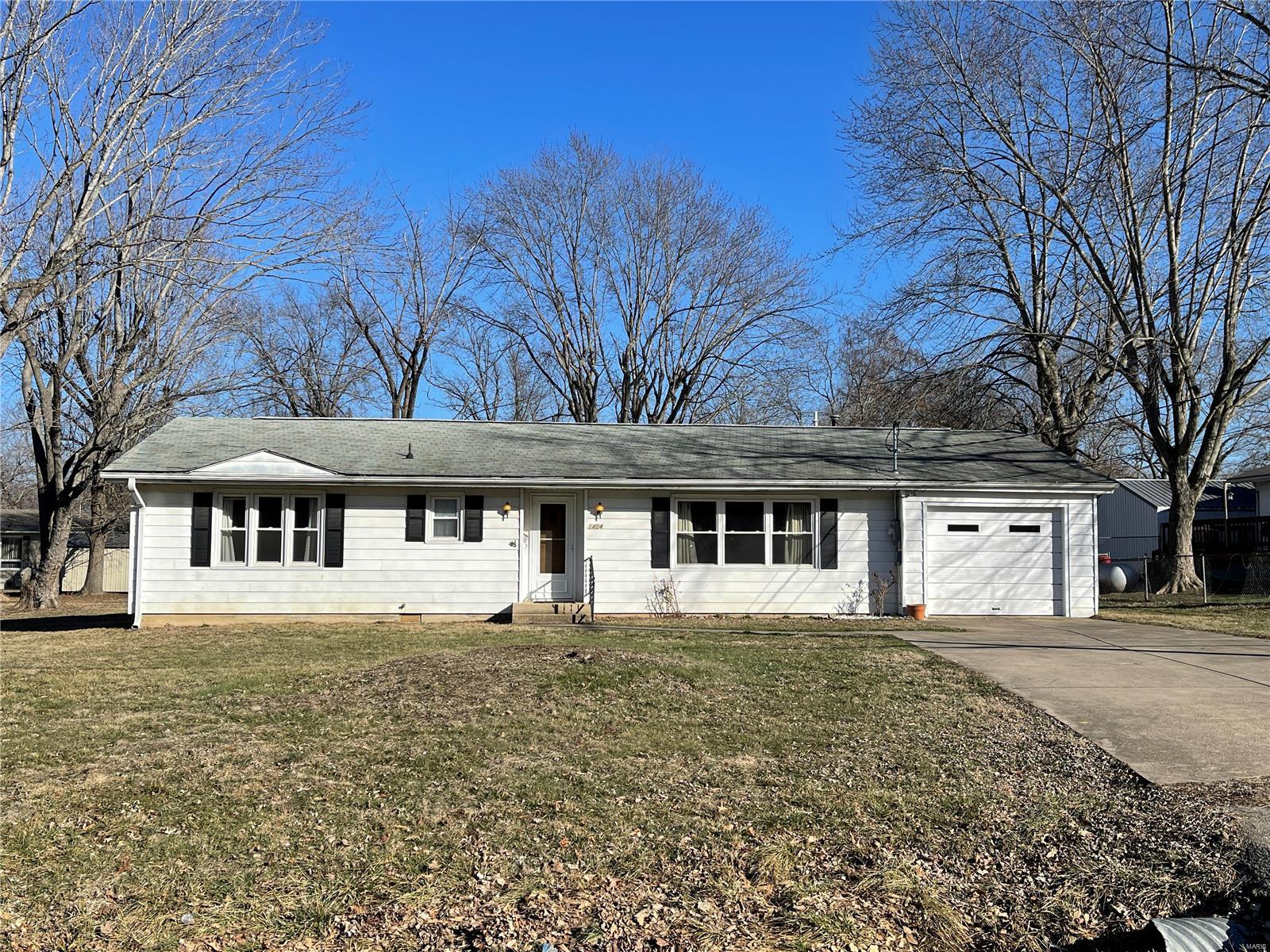 Lots to offer with this 3 bedroom, 2 bath home that has a 1 car attached garage and a detached garage/shop. This home has a living room, dining room and a kitchen with plenty of wood cabinets, a closet pantry, gas range, dishwasher and a new refrigerator in 2022. Laundry room includes a utility sink and a washer and dryer.  3 bedrooms with wood floors and plenty of storage as there are 8 closets throughout the home. The 2 bathrooms each have a shower with one of the showers being oversized and has 2 seats. Vinyl windows, Lennox propane furnace and central air. 33' x 14' covered patio for those year round barbecues. Attached one car garage. 24' x 20' detached garage/shop building with electric, concrete floor and garage door. Nice level yard. Good location within just a short distance to shopping and restaurants.