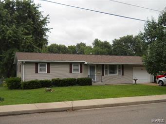 What a find!  Three bedroom ranch home on level corner lot, with fenced back yard, covered patio, and 16x12 screened in  deck.  Vinyl siding, new roof, corner lot, and garage.  Home is cozy and well maintained, ready for a new owner.  Appliances stay.  Even has a backup gas heater for power outages!  Just a few blocks from Karsch Blvd. in Farmington, so close to everything!  Call today before it's gone!