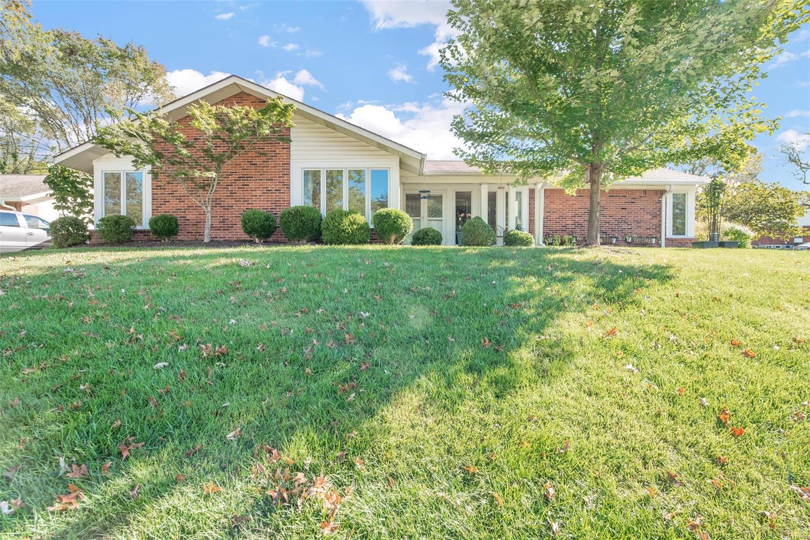 Pristine, Updated, Move-in ready. This gracious ranch home is situated on a beautiful corner lot adjacent to a quiet cul-de-sac. Wonderful location as it is close to Queeny Park, walking distance to Henry Elementary, and minutes from shopping, highways, and hospitals. Open floor plan affords easy one-floor living, light filled, and generously sized windows at every turn. Covered porch & double front doors welcome guests into the tiled foyer flanked by a spacious living room and welcoming dining room. The kitchen offers custom cabinets, quartz countertops, island, recessed lighting & hardwood floors.  Updated Lg Master Suite. Great Room offers vaulted ceilings, Bose surround sound, ample space and can easily be used as an optional bedroom. The hearth-room, adjacent to the kitchen, opens to the backyard that has been thoughtfully landscaped to maximize privacy and a park-like setting. 2 car garage w/ additional off street parking. Award Winning Parkway School District.