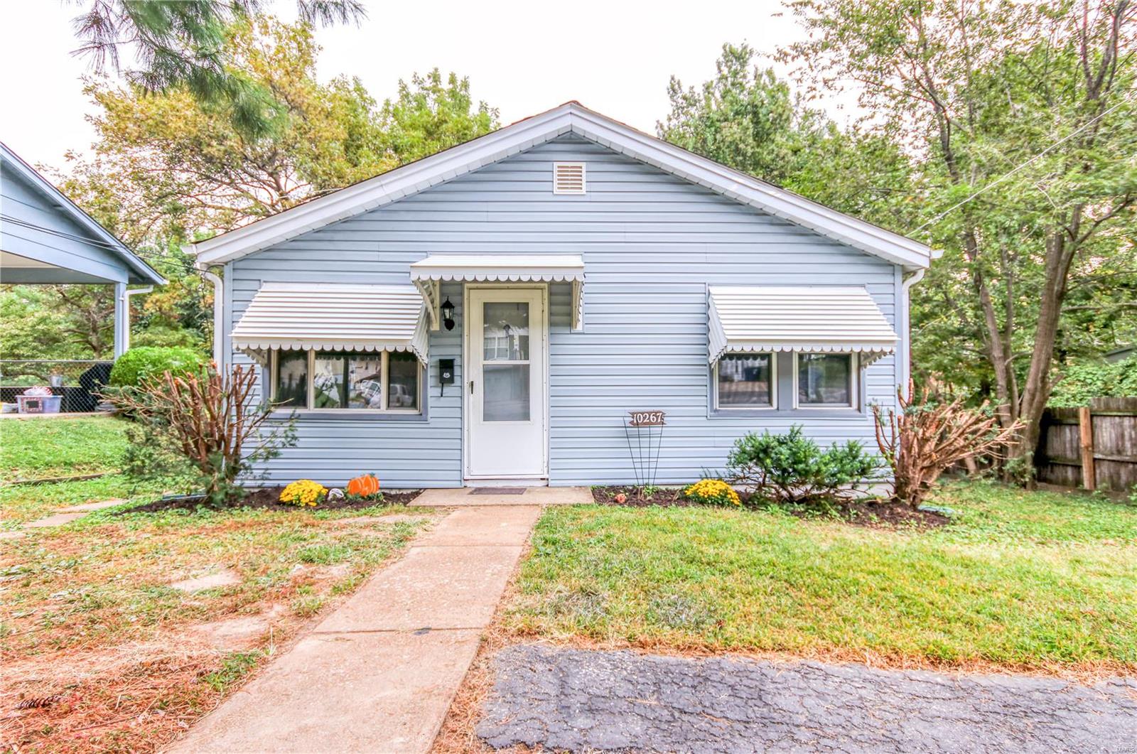 Don't miss this absolutely adorable home!  There are 2 good sized bedrooms,  The home has been very well maintained with lots of updates being done through the past several years including the roof,, furnace, dishwasher and garbage disposal. New kitchen flooring and white cabinets make the kitchen a joy.  The sellers say even the refrigerator can stay! The sunroom lets in lots of light and has a perfect view of the level, fenced backyard.   The swingset can stay or be removed.  Full walk out basement Additional Rooms: Sun Room