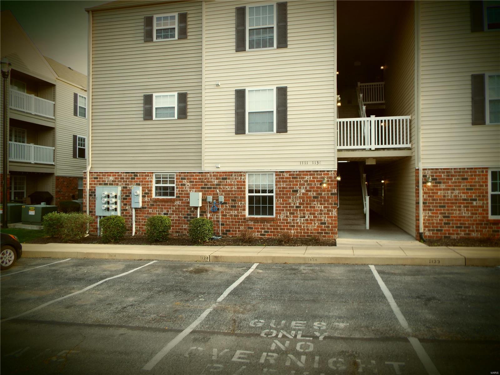 BACK ON THE MARKET!  NO FAULT OF SELLER!  You will love coming home to this beautiful ground floor condo in Lake St Louis in the much sought after Saratoga community.  Open floor plan, 2 bedroom, 2 full baths.  Master bedroom has a large walk in closet and full bathroom.  Entry foyer includes private laundry room and a full guest bathroom.  All kitchen appliances stay which includes brand new dishwasher, nice refrigerator, built in microwave and double oven with smooth cooktop.  Walk out onto the covered patio from the kitchen and there is also a storage closet.  Each condo has an assigned parking space.  The $150 monthly HOA fee includes water, sewer, trash and landscaping and snow removal.  Your only utility bill is electric!  THIS WILL NOT LAST LONG AT THIS PRICE!  Agent owned. Location: End Unit, Ground Level
