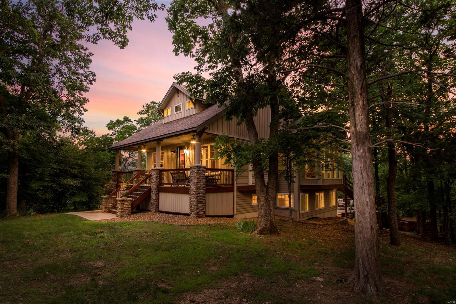 Custom built home secluded on a hill in the heart of Augusta Wine Country. Enjoy nature’s beauty indoors from nearly every room thru the multitude of picture windows or bask in its splendor on the covered front porch. As you enter you will be awed at the open & bright foyer, dining room & hearth room accentuated by columned walls. Hearth room features stone surround gas fp w/ built-in entertainment center. The kitchen/breakfast room has hardwood floors, hickory cabinets,built-in bench seating & bistro breakfast table, SS appliances & skylight. Vaulted master bedroom suite w/ dual w/i closets,soaking tub & separate shower. Finished LL has plenty of space for entertaining w/ sleeping room, bath & 2 walkouts. Features security system,oversized 3 car garage,2 maintenance free Trex decks,fire pit & hot tub situated on 2.5 acres!! Newer Roof, windows, garage doors,skylights,siding,rain deflectors & water heater. Gated community w/ pool, tennis courts, clubhouse, 6 stocked lakes & much more!