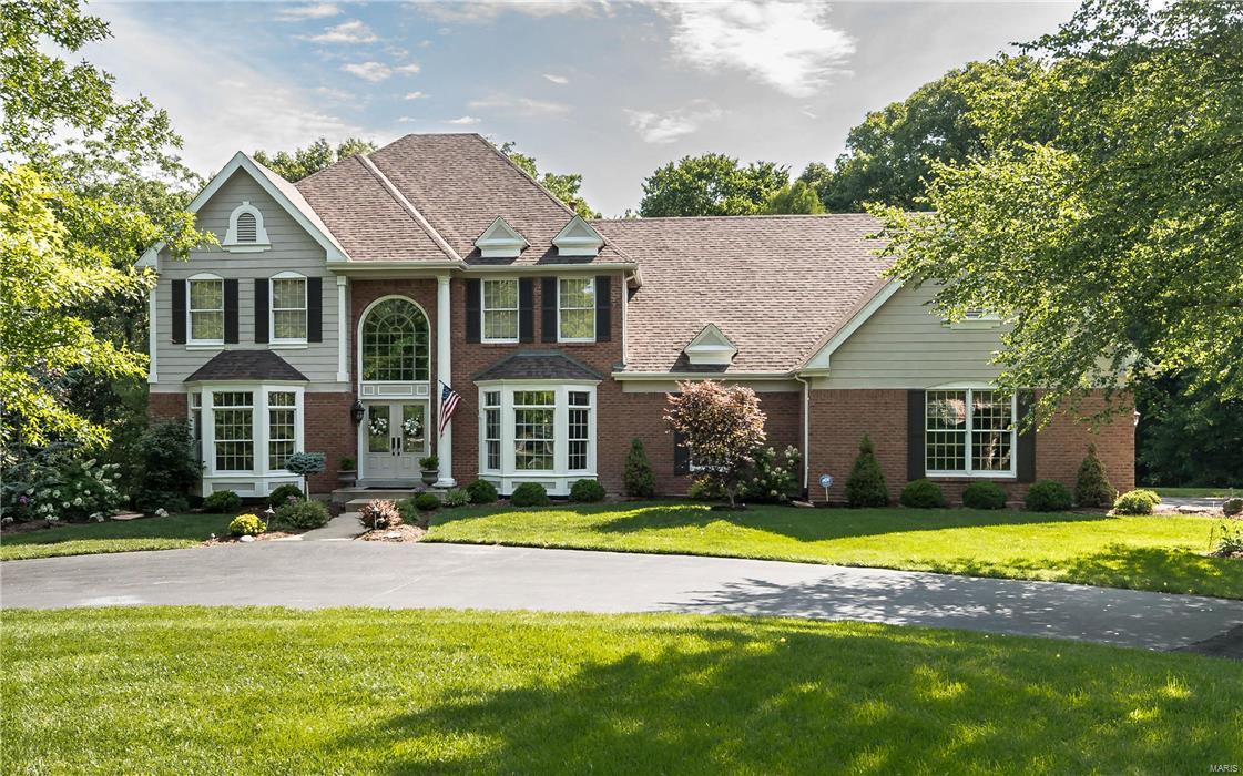 Spectacular 1.5-story in prestigious Kehrs Mill Estates! Situated on a private, scenic 1.36 acre lot enhanced by lush landscaping, circle drive&culdesac. Exceptional architectural dtls incl wood flrs, millwork, palladian windows, dimensional ceilings&skylights.  Impressive 2-story hardwd fyr flanked by a sophisticated dng & lvng rm.  A dramatic 2-stry great rm boasting a floor to clng brick fpl, wet bar.  The 1st fl mstr suite offers architectural dtl, rmdld lxry bath&walk in clst. Rmdld ktchn w/ built in frdge, wine frdge, 42" cabinets, wrmng drawer, lg cntr isl, vaulted brfst rm opens to a warm spacious hearth rm w/a brick fireplace. Limitless optns w/Lndry/ktchn/mud rm off kitchn. 3 bdms upstairs each w/full bath. Lwrlvl w/a fpl, exercise, game, rec room&u add an addl bdrm.  Lrg laundry work center, which can also host an addl kitchen. Impressive wood flrng, new carpet on the uppr lvl, 3 car side, 3 custom decks, 3 fplcs, security, sprnklr...this home leaves nothing to be desired!!