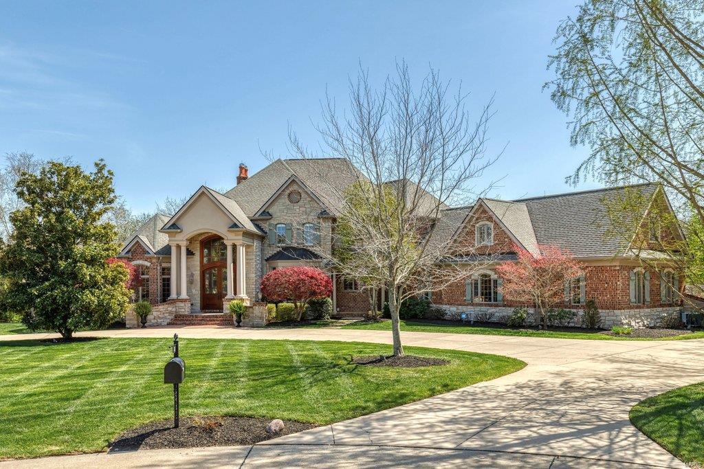 Superior craftsmanship & distinctive design elements define the architectural integrity of this European-styled Estate home. 2-Sty foyer with domed ceiling & dramatic sweeping staircase leads to library-paneled study, elegant dining room & stunning great room with architectural pillars, 2-sty bow window & marble fireplace flanked by built-in bookcases. State-of-the-art kitchen featuring cherry cabinetry, granite countertops, commercial grade appliances, 11’ center island & wet bar adjoins light-filled breakfast room & hearth room highlighted by floor-to-ceiling stone fireplace. Coffered master bedroom suite with beautifully appointed bath offers an appealing retreat. Front & rear staircases access 3 additional ensuite bedrooms, bonus room & 2nd laundry. Lower Level includes recreation room with wet bar, game room, media room, family room with 3rd fireplace, workout room & guest suite. Situated on a wooded 3-ac lot with deck, patio & resort style pool surrounded by landscaped gardens. Additional Rooms: Wine Cellar