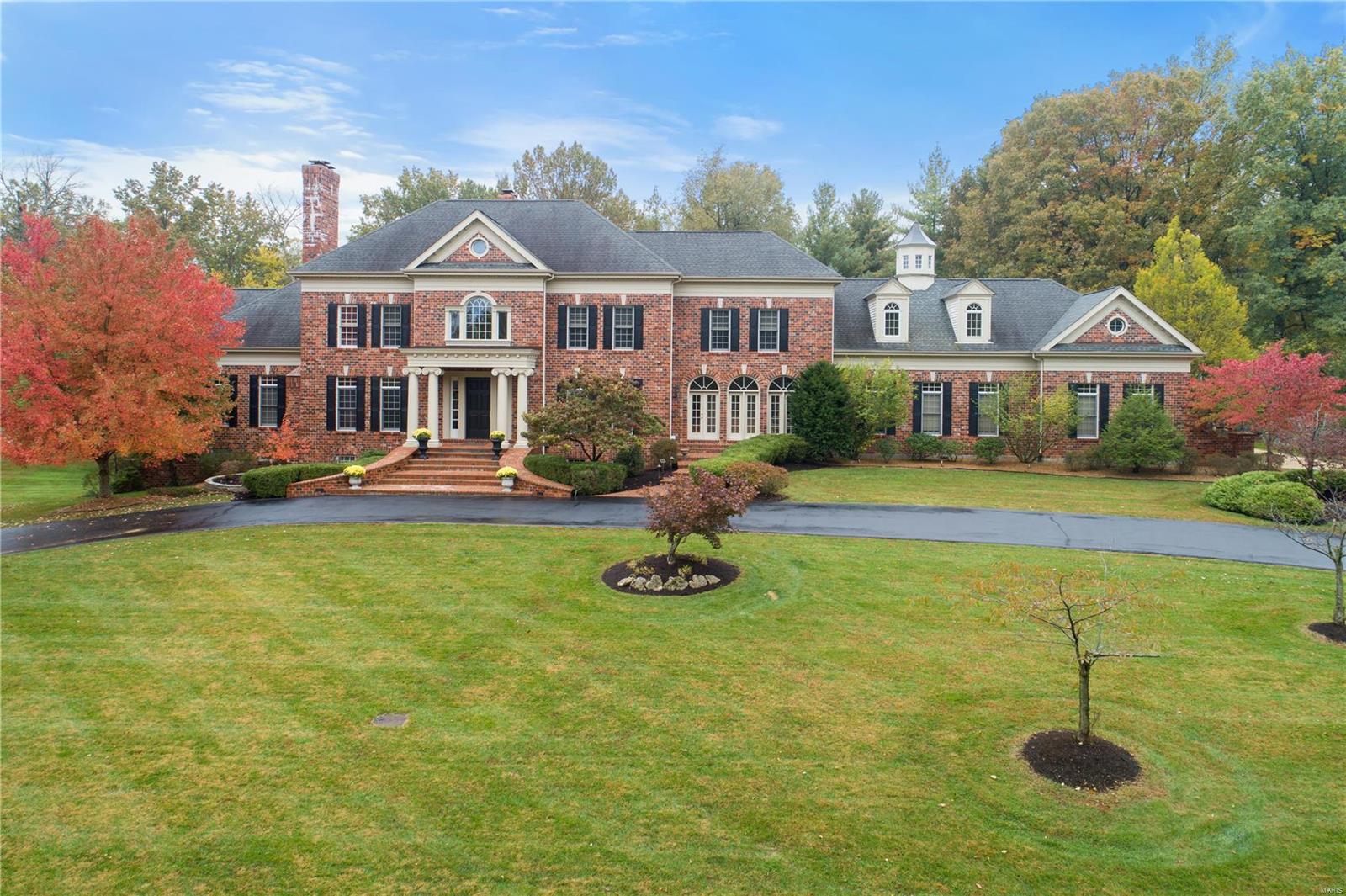 Custom built 1.5 story home built by premier Scherholtz construction. Exquisite  attention to detail is evident  on all 3 levels of living space.This private 2+ acre setting provides  rare opportunity live  in this distinguished  location. Sunlight streams into each room through a plethora of windows.The grand entry is both warm and welcoming and is adjoined by a richly appointed library and elegant dining room. Sweeping staircase provides a spectacular view of formal living room with a 20 ft. high wall of windows and 1 of 6 fireplaces. Gather your friends + family around the gourmet kitchen + hearth room. Hearth room is warm + cozy  with stained bead board ceiling and stone hearth. There's more! Romantic main floor master suite adjoins boudoir that is an oasis for reading, sipping a night cap or officing in style. Luxurious master bath with custom outfitted  closets.
Finished lower level with fabulous kitchen, wine storage, workout  gym + game room. 
4 car rear entry garage Additional Rooms: Wine Cellar