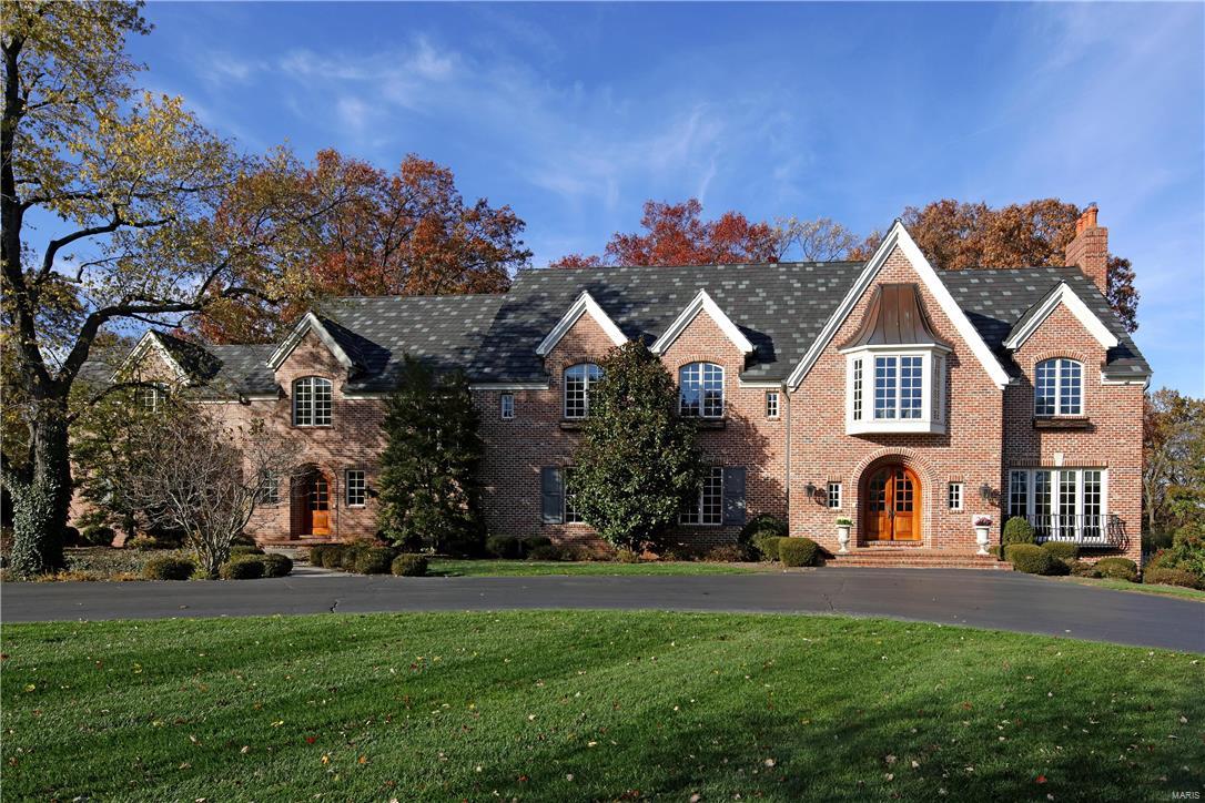 Magnificent 14 years new all brick custom home with exquisite architectural elements, fresh modern colors and updates throughout.  Starting with the front to back grand foyer with curved staircase that shares the living room with French doors and FP. Formal dining room with FP and boxed beamed ceiling flows into the fabulous butler’s pantry and newly refined gourmet kitchen which transitions in to the double height hearth room with large bay and French doors to the large rear terrace. His/hers studies, laundry room and two powder rooms complete the main floor.  Upstairs the master suite with FP and sitting room adjoins the dressing room and luxury bath with steam shower. 3 en suite bedrooms, sitting room, bonus room and laundry room complete the 2nd. Finished w/o LL with exercise, rec room, FR w/FP, full bath and possible extra bedroom. 4 car oversized garage, pool, generator, storage garage & parklike 3 acre lot.