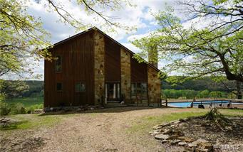 The river views from this incredible property are unmatchable!  This secluded Gasconade River farm has 559 +/- acres with over a mile of river frontage.  There are 7 separate pastures, 4 ponds, a spring, small caves and the Jack Creek runs through the property.  The large 1 bedroom home has 2 baths, beautiful vaulted wood ceilings, a fireplace, a full basement, an office/spare room, central heat & air and is partially furnished.  422 +/- acres are timber and valued at $320,825 (forestry report available).  This property is truly an outdoorsmans dream and offers something for everyone!