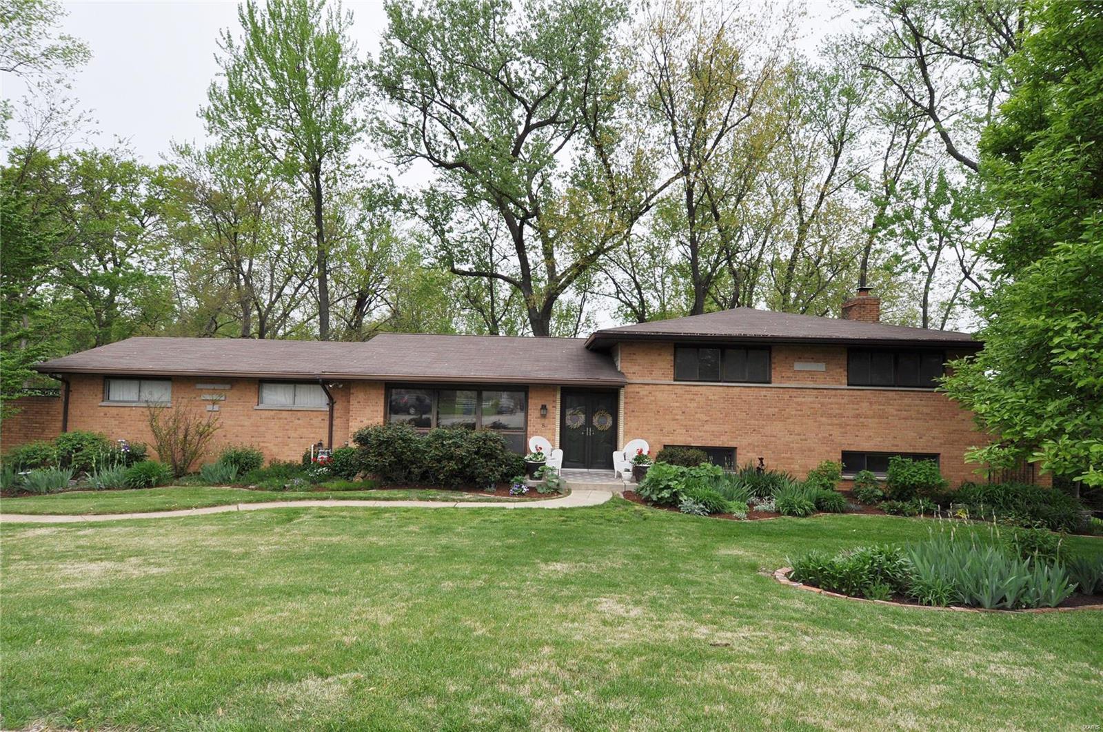 Est. 1958: Wonderful mid-century Olivette all-brick multi-level home featuring a great, livable floor plan w/lots of extra spaces & FANTASTIC updates! Step inside to a formal entryway w/closet that leads into an open concept formal living & formal dining room w/hardwood floors & fireplace, then into a gorgeous, fully renovated chefs kitchen w/custom cabinetry, high-end appliances, quartz counters & skylight. The upper level leads you to 3 generously sized bedrooms, including a primary suite w/pvt full bath, and an updated hall bath. Downstairs, the walkout at-grade level offers a spacious rec/family room, two addt'l rooms (great offices or guest spaces) & half bath. Plus, an addt'l finishable level offers laundry & loads of storage. Not to mention an attached 2-car garage & spacious, very private, lush landscaped park-like yard! Tucked away on a quiet cul-de-sac, this friendly neighborhood is centrally located near amenities, shopping, & more in sought-after Ladue Schools! HURRY!