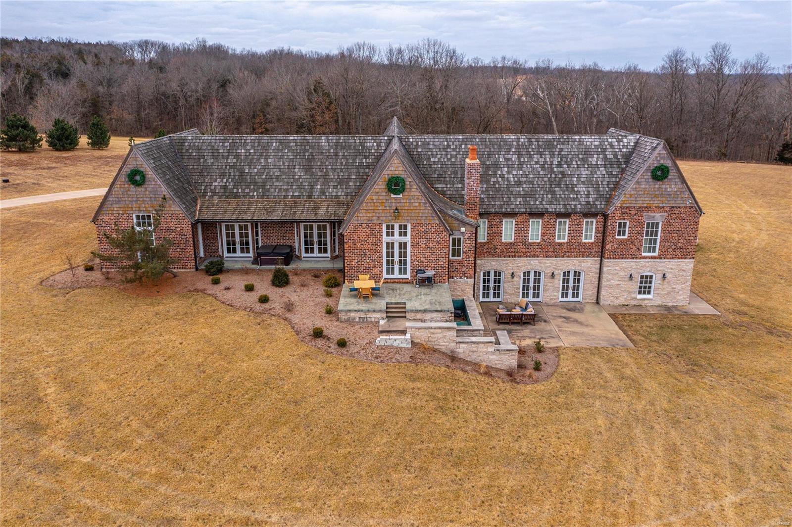 Gorgeous 9.6 acre estate w/ over 6700 Sq Ft of living space! Updates abound w/ new hardwoods, fresh paint, updated bathrms & custom touches throughout. The gourmet kitchen features custom cabs, granite counters, ss Monogram appliances including built in fridge & custom hand made center island w/ butcher block counter, wine cooler & stunning banquette. A spectacular cathedral ceiling from kitchen opens to hearth rm w/ wb stone fireplace & French doors to the private patio. Master bedrm suite is a dream w/ vaulted ceiling, walk in closet, custom wardrobe & luxurious bath w/ custom tile walk in shower, et tub & double vanity. 2 spacious bedrms share updated Jack/Jill & 4th bedrm sports newly renovated en suite. Dining rm, living rm, study, powder rm & huge laundry/mudrm round out main level. The walk out LL boasts 5th bedrm, 4th full bath & 2 huge rec rms walking out to 2nd private patio w/ wb fireplace. Zoned HVAC, 4 car garage, prof landscaping & walk Campbellton elem! DO NOT miss out! Additional Rooms: Mud Room